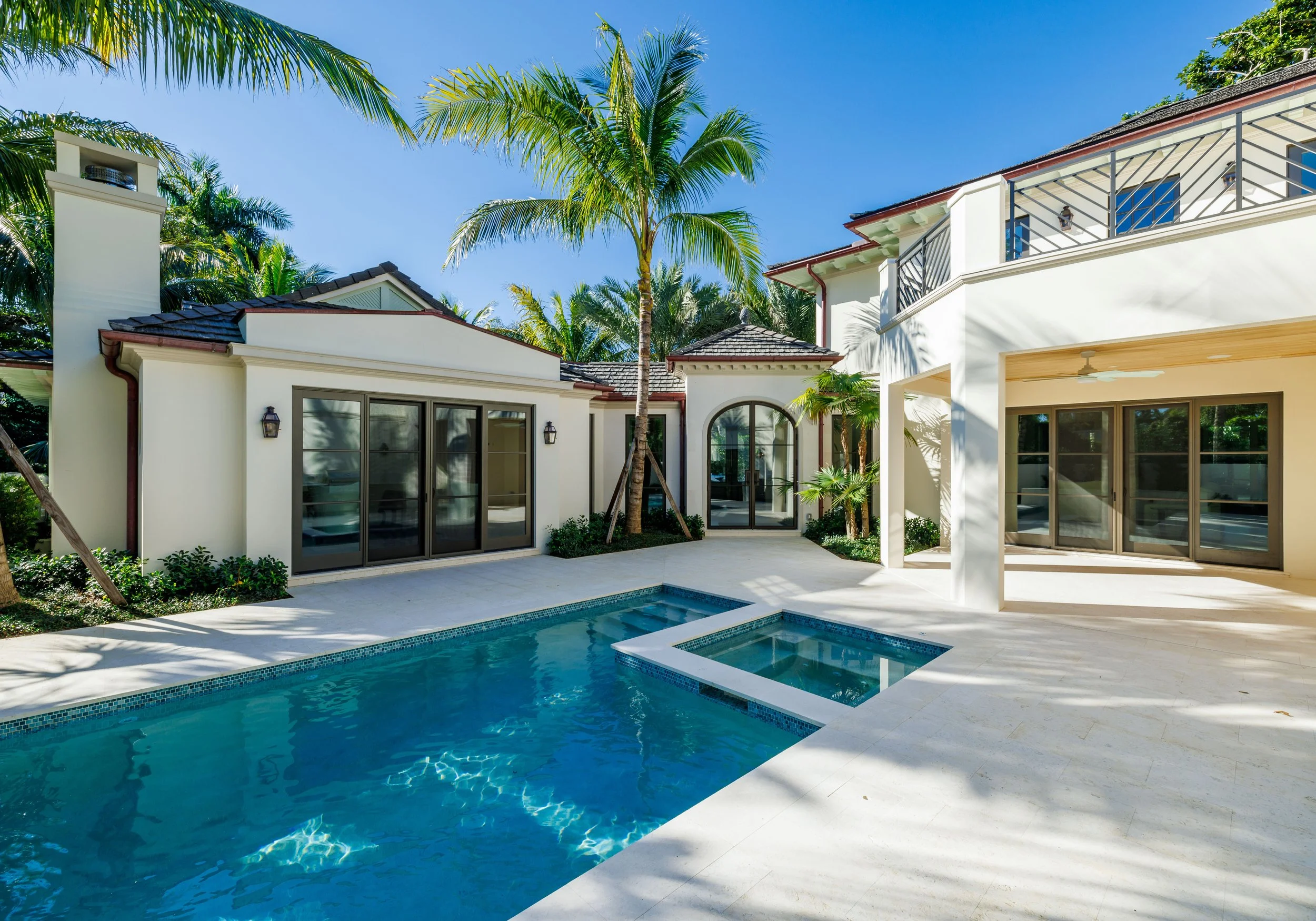 Interior courtyard with pool, loggia, and second floor deck.