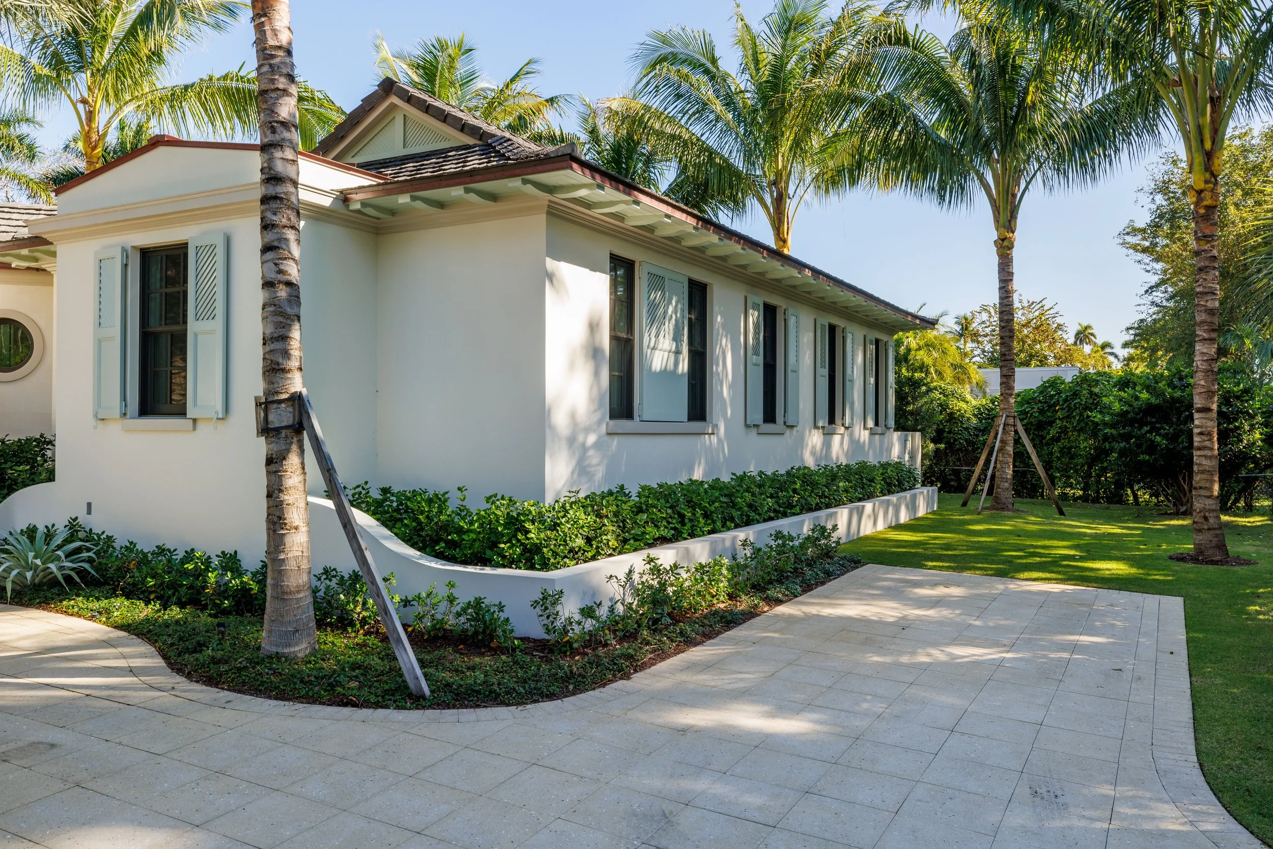 Palm Beach Caribbean Style Home with lush landscaping