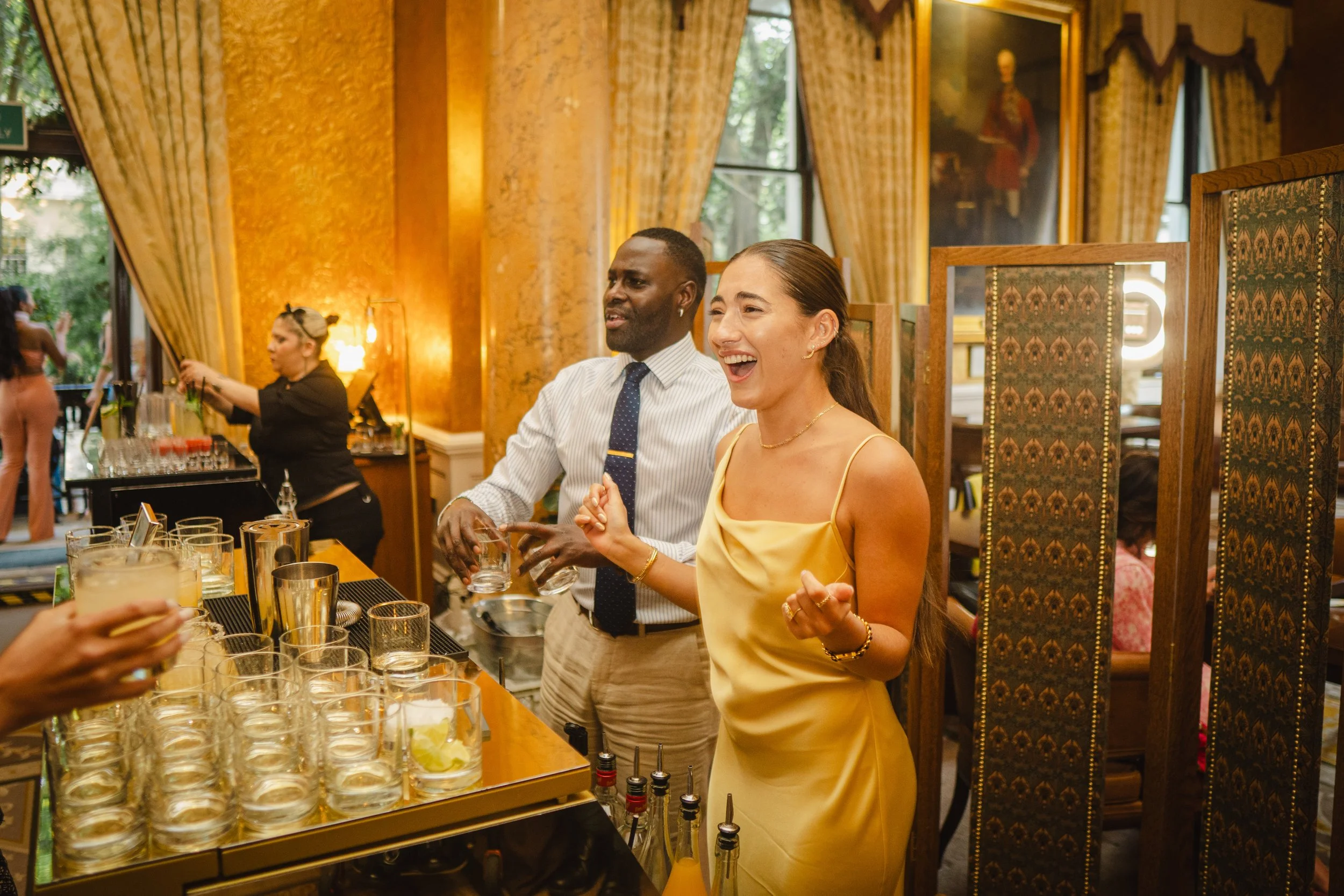 Bespoke wedding cocktail bar hire with floral styling and elegant décor at reception.