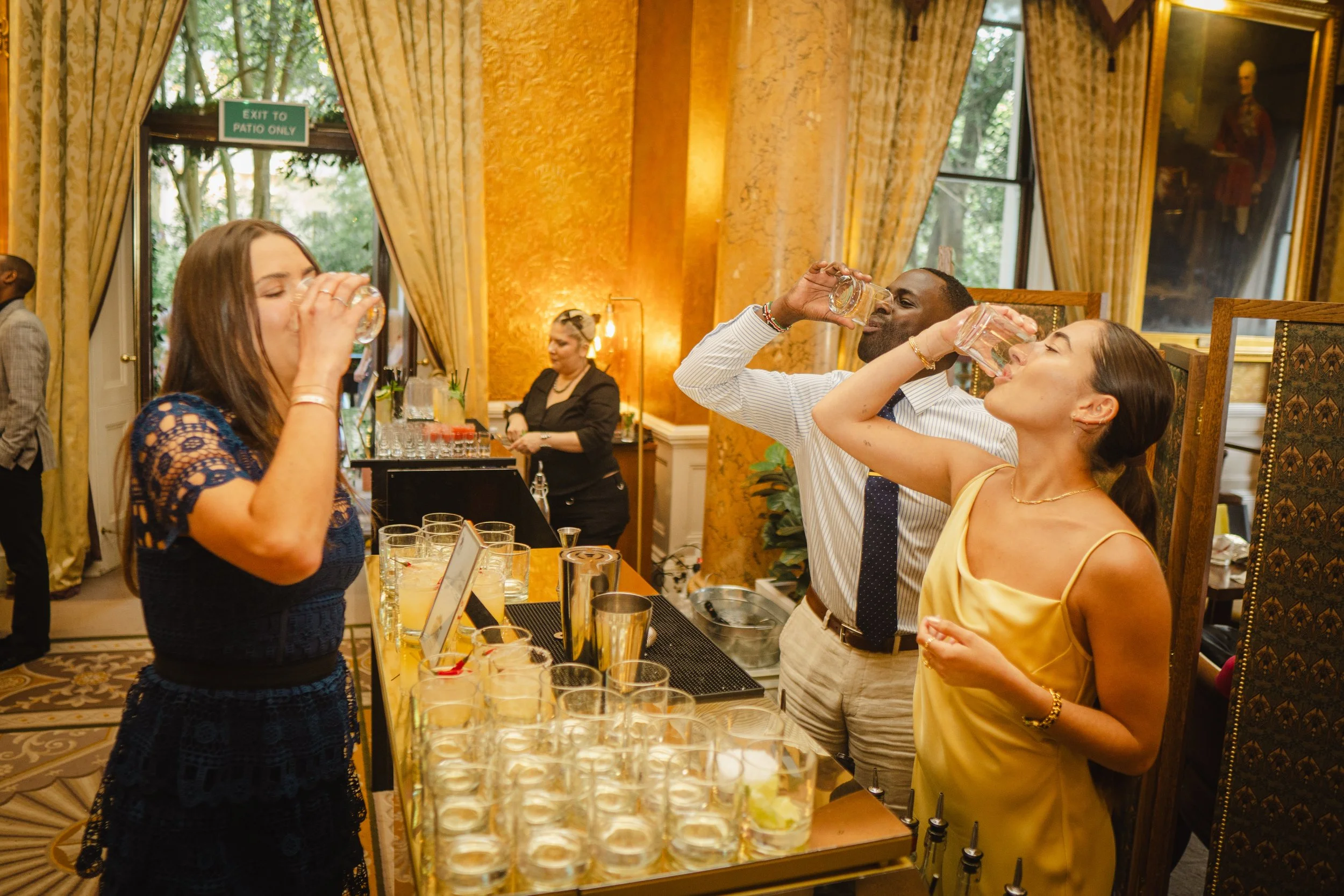 Guests enjoying personalised cocktails from cocktail bar hire for weddings in London.