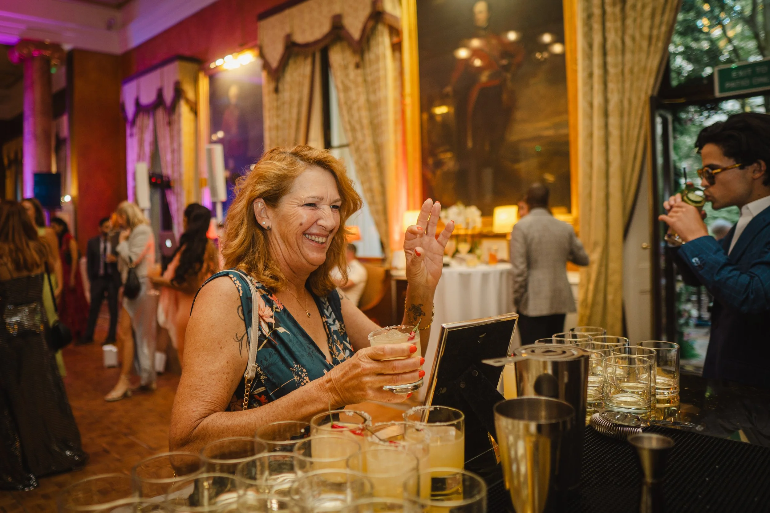 Wedding mixologist serving alcoholic and non-alcoholic bespoke cocktails at luxury wedding reception.