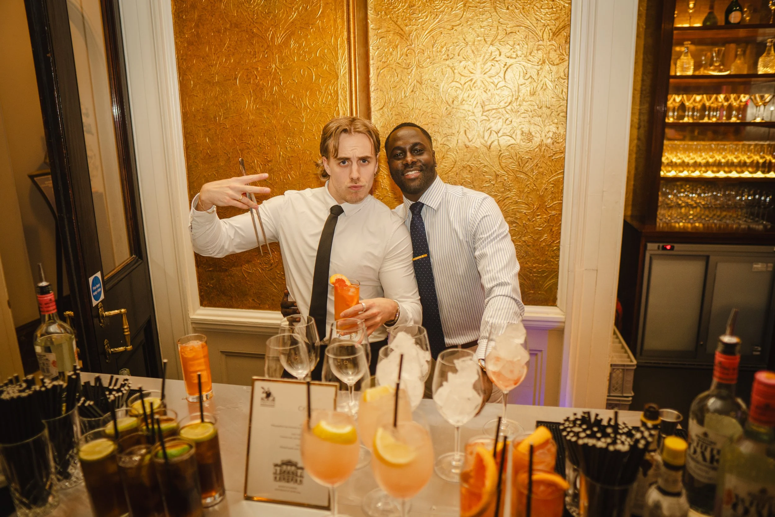 Luxury wedding reception featuring a bespoke cocktail bar and professional wedding mixologist.