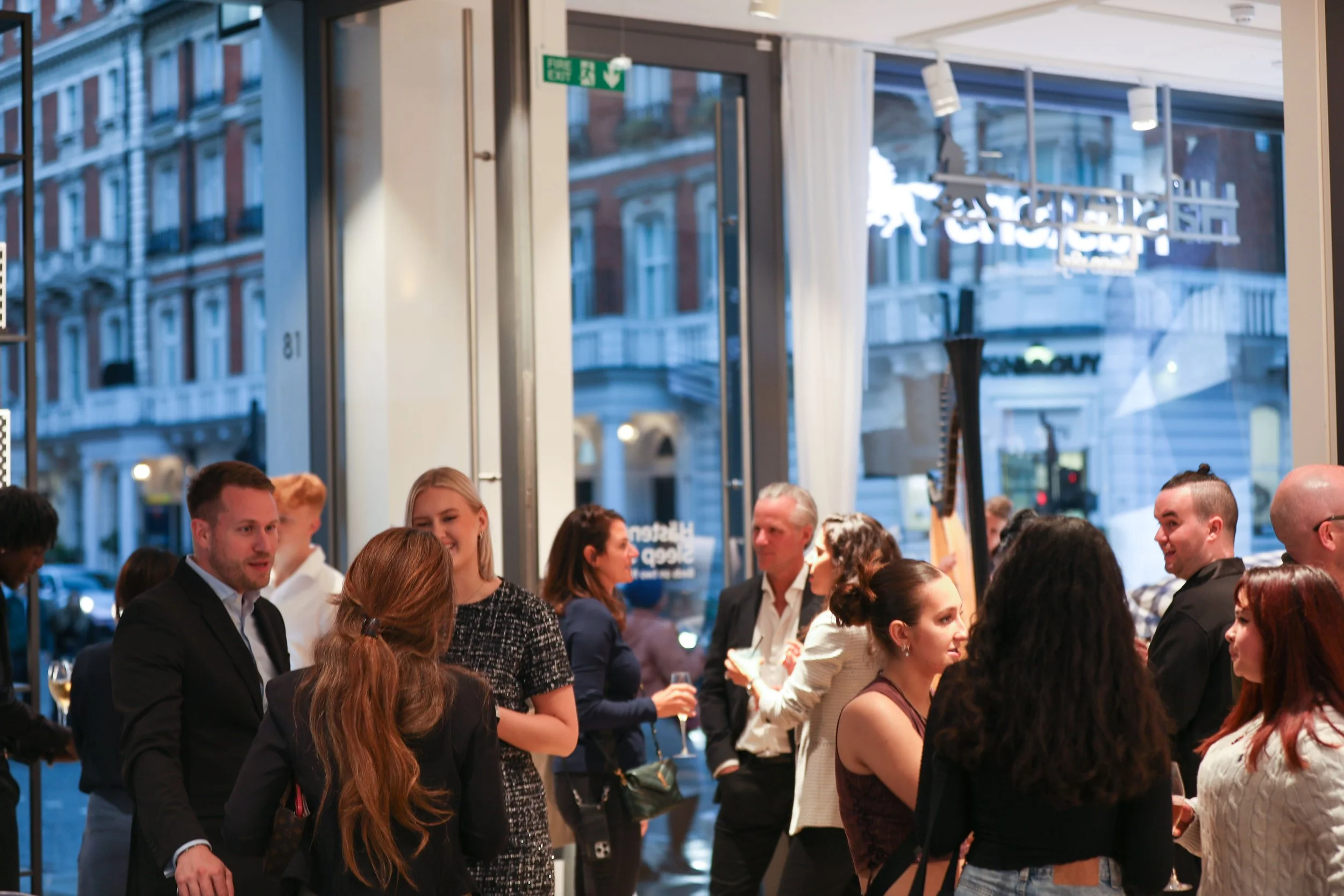 Corporate cocktail bar hire creating calm and refined client networking atmosphere.
