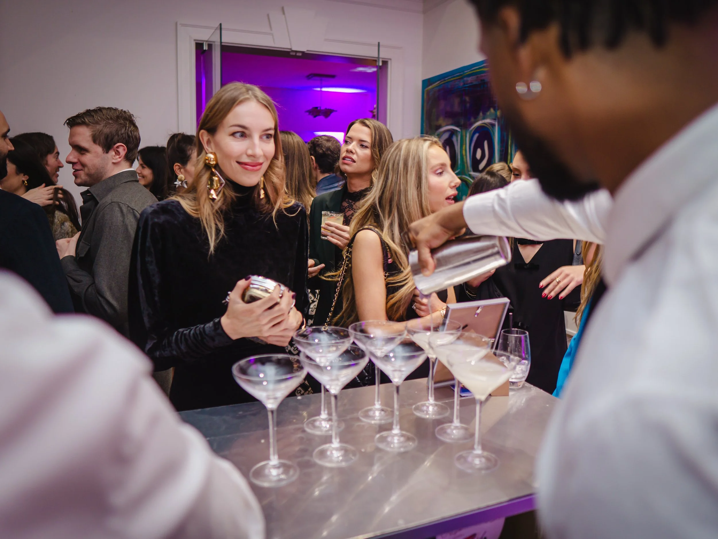 Private party cocktail bar hire creating social atmosphere at luxury London home event.
