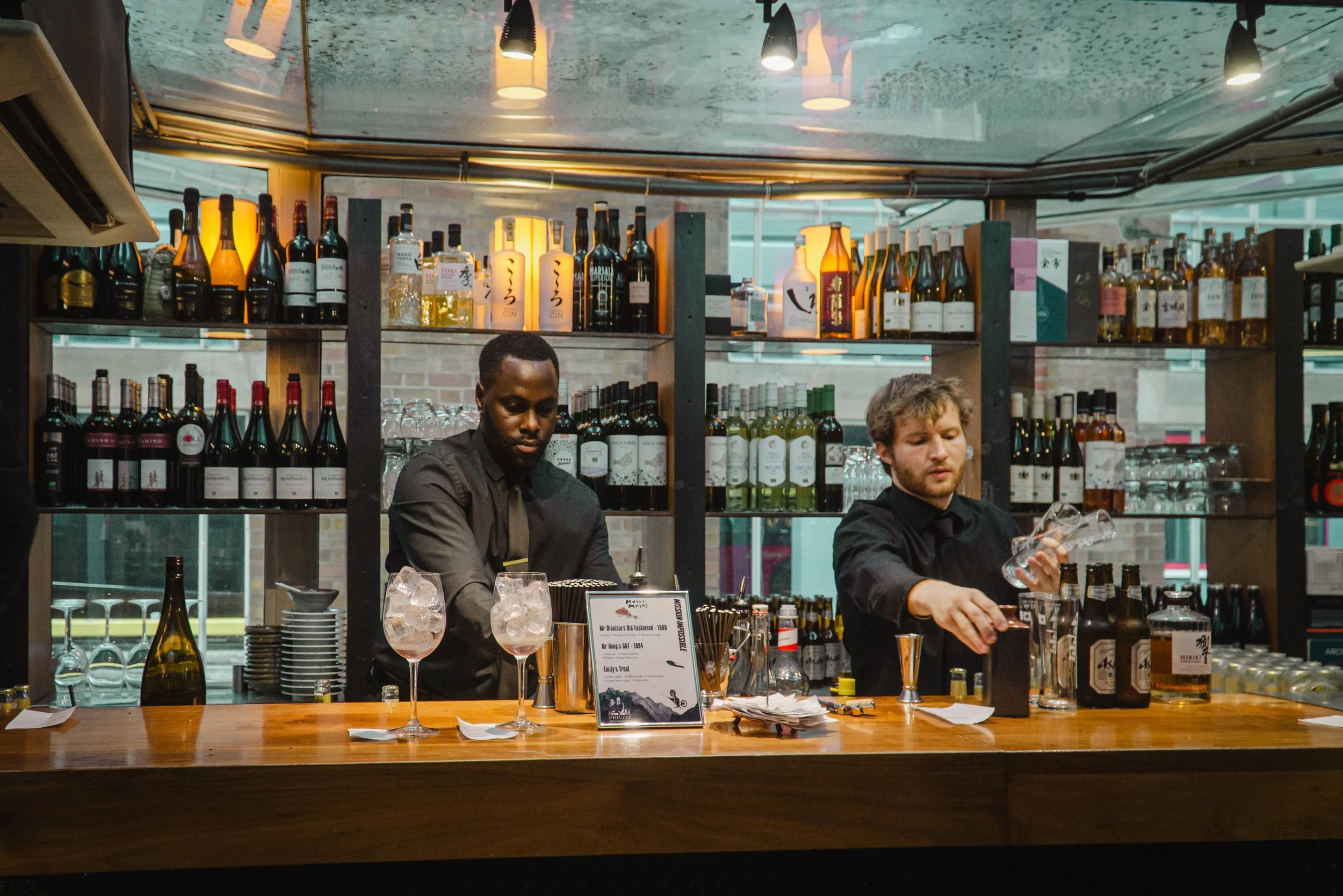Luxury corporate hospitality with bespoke cocktail bar creating premium client experience.