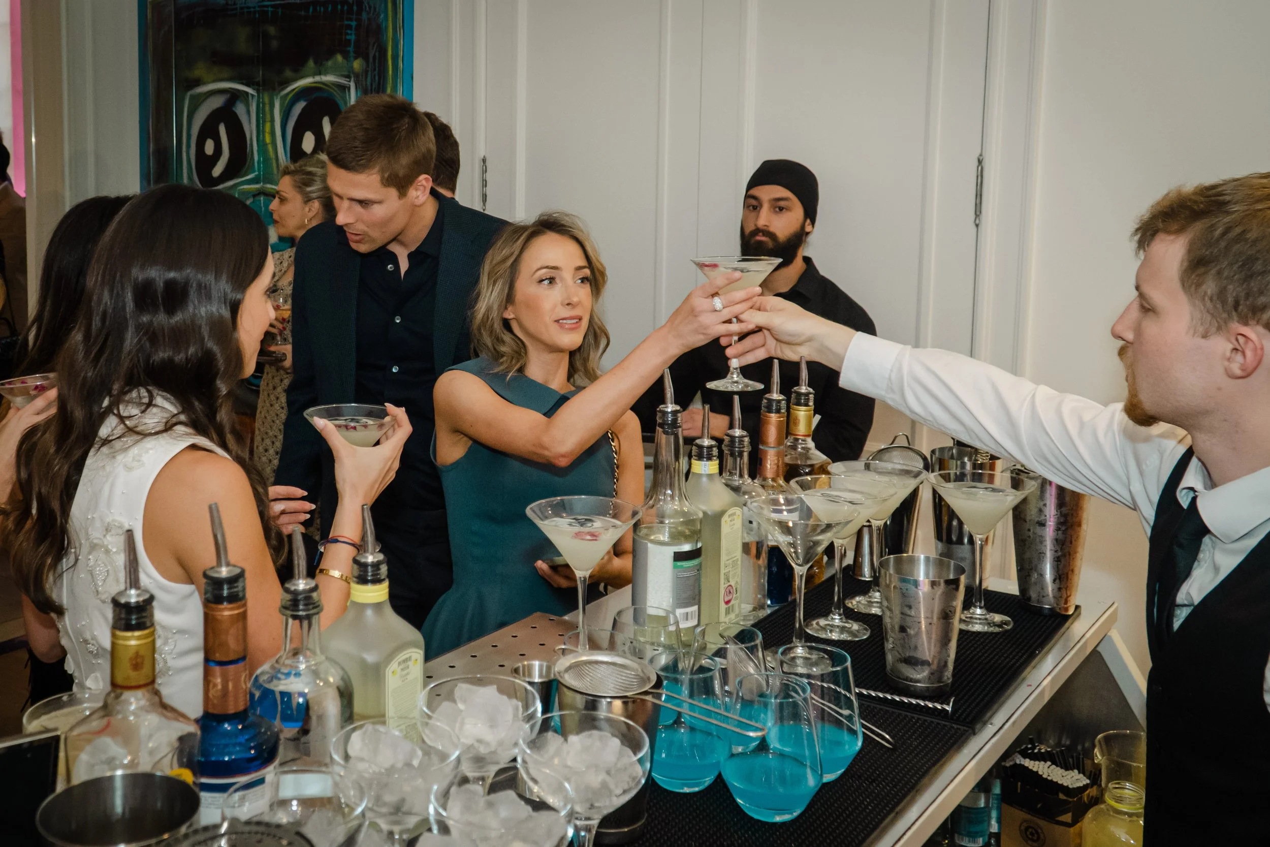 Private bartender providing attentive and seamless hospitality at an elegant private event.