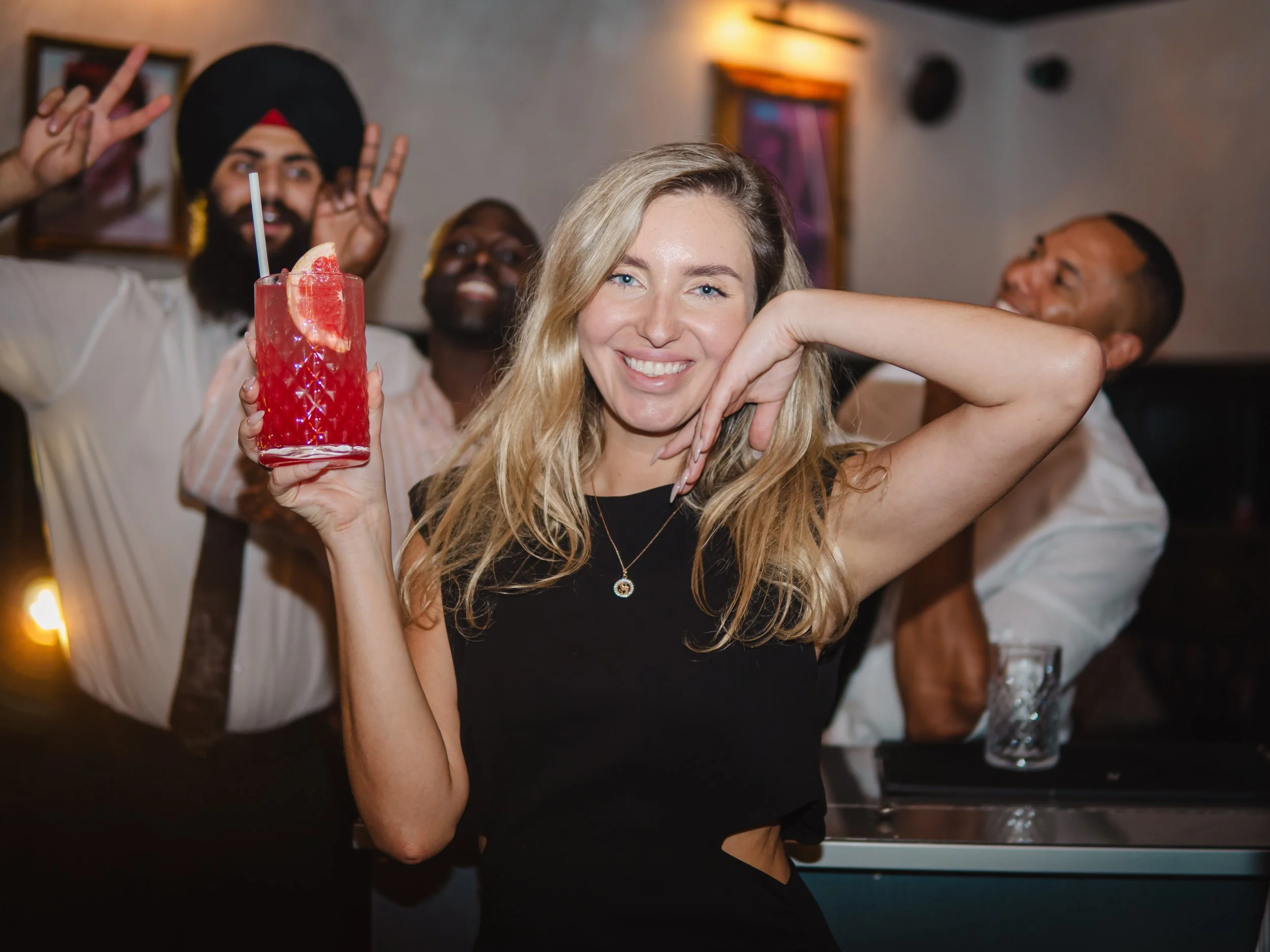 Guests celebrating housewarming with signature cocktails from private party cocktail bar hire.