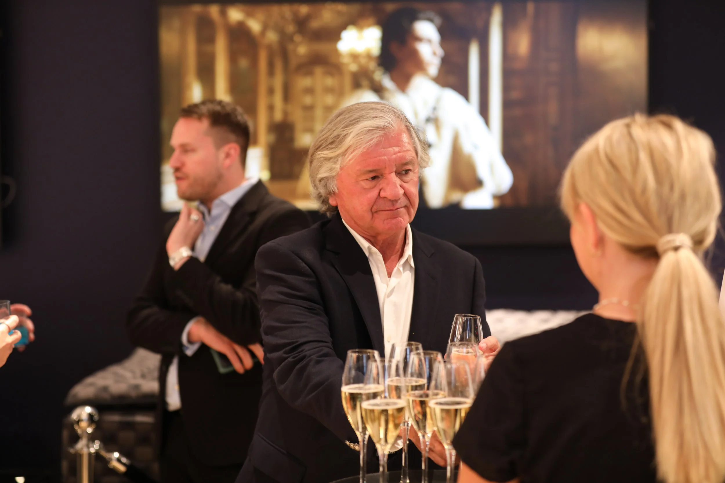 Corporate mixologist creating a personalised hospitality experience for a business event guest.