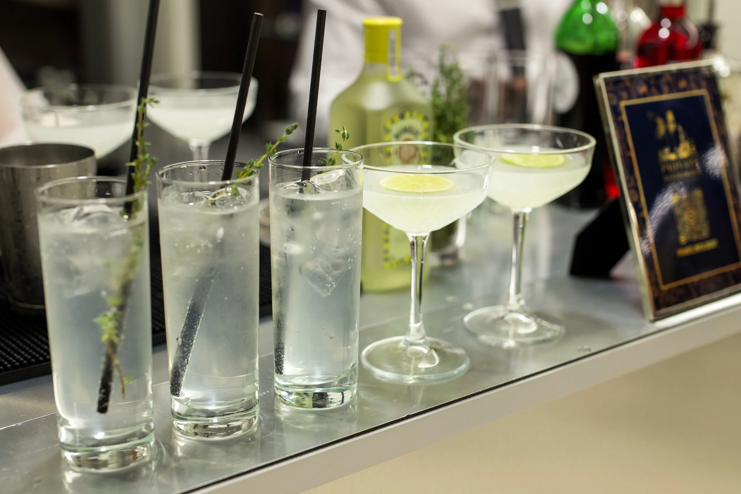 Luxury home bar setup for New Year’s Eve with crystal glassware and garnishes.