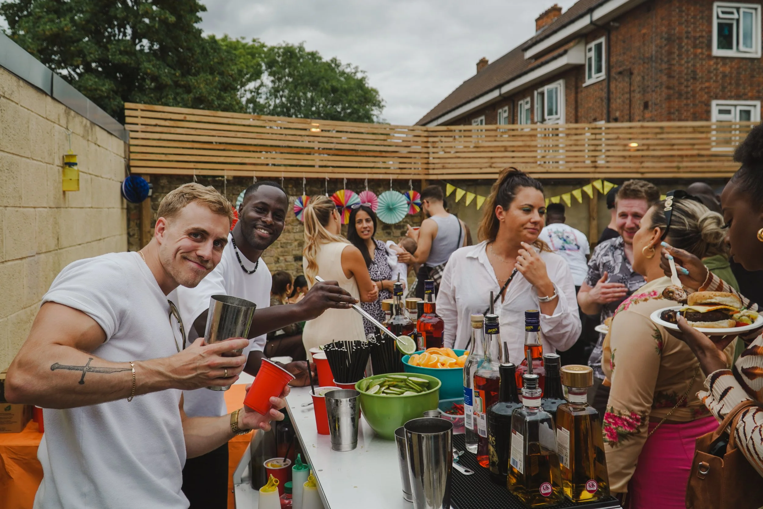Private party cocktail bar hire creating social interaction at modern house party.