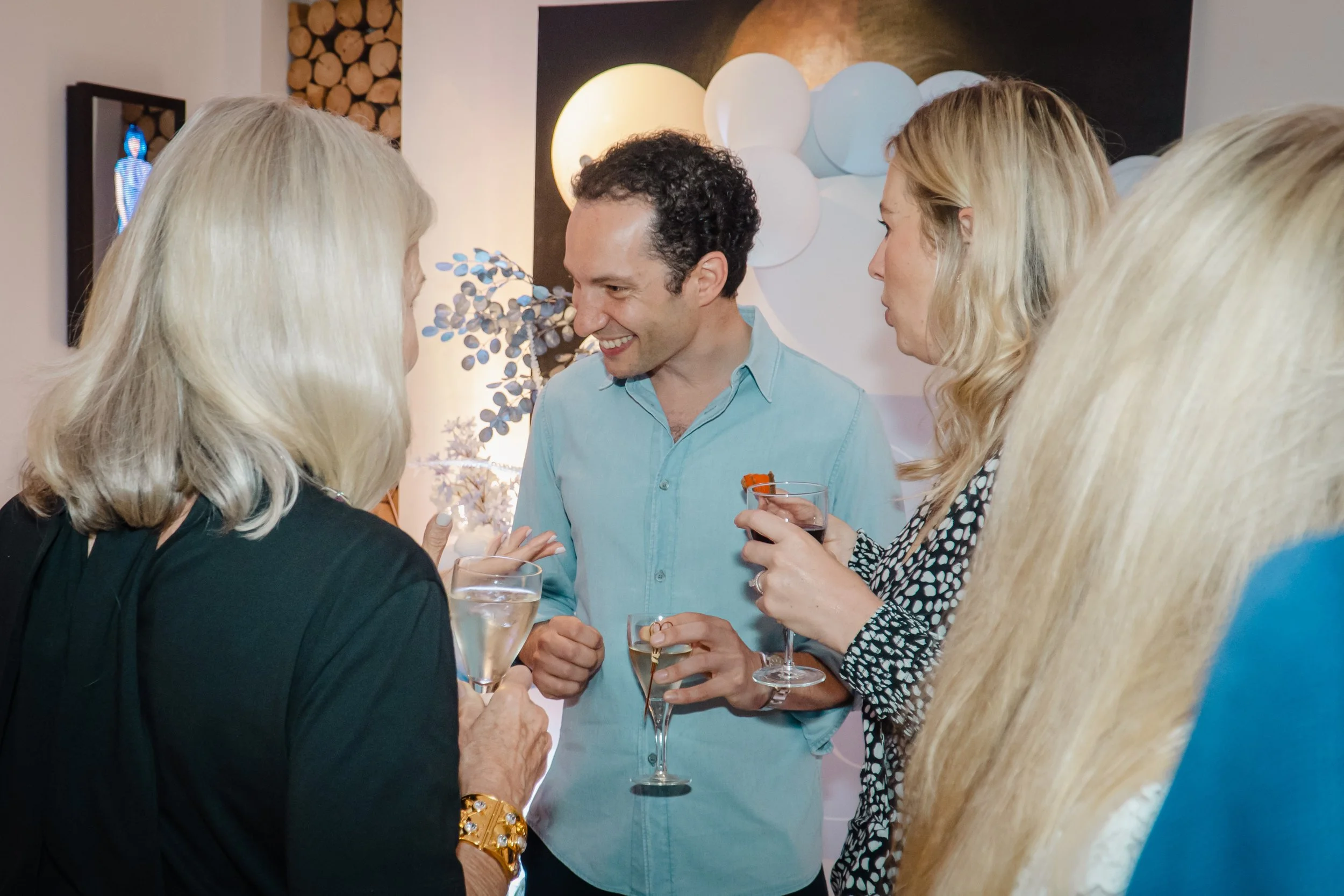 Guests enjoying luxury hospitality from private mixologist at London home party.