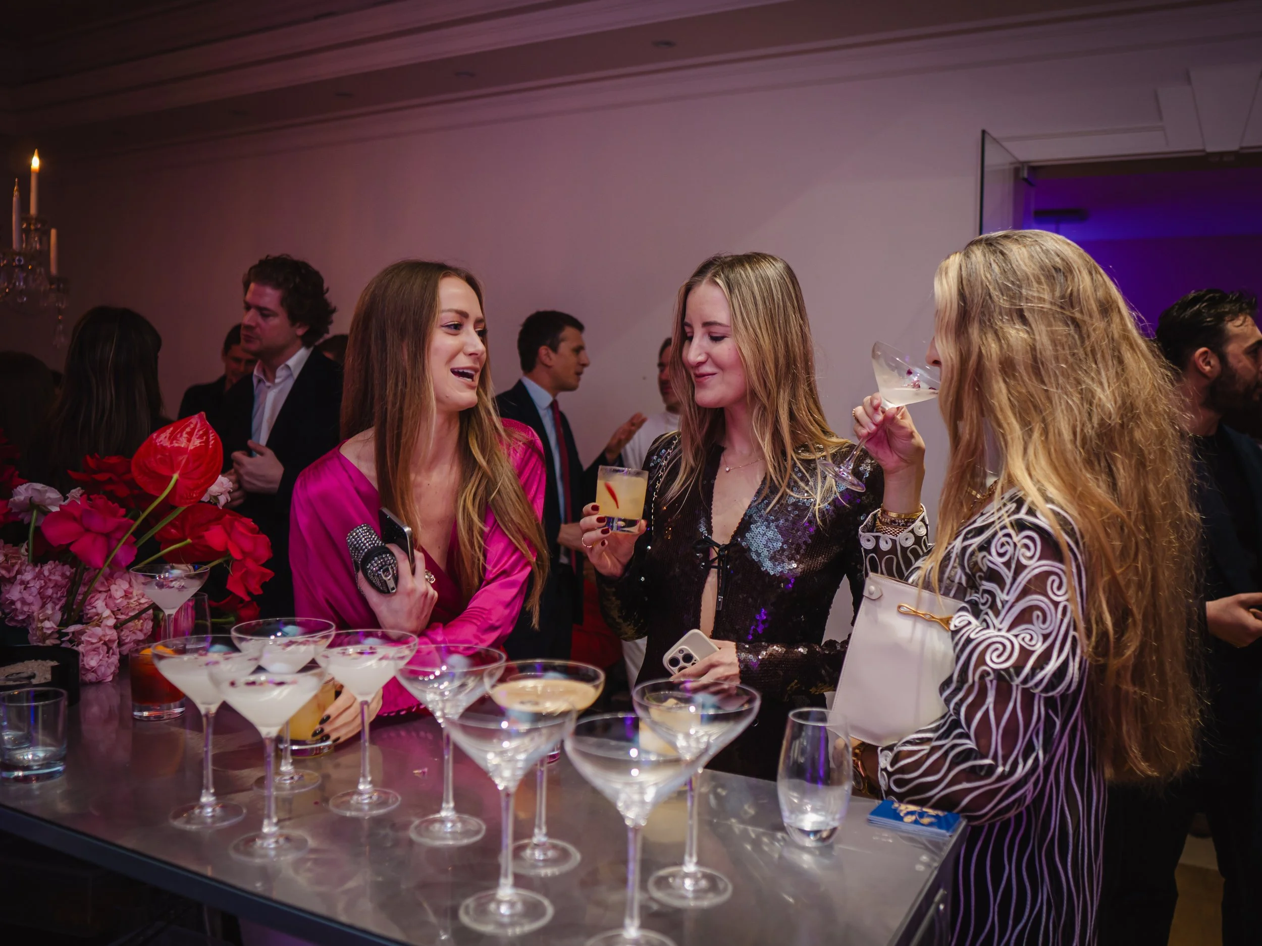 Guests enjoying hosted cocktail experience with private bartender at London home event.