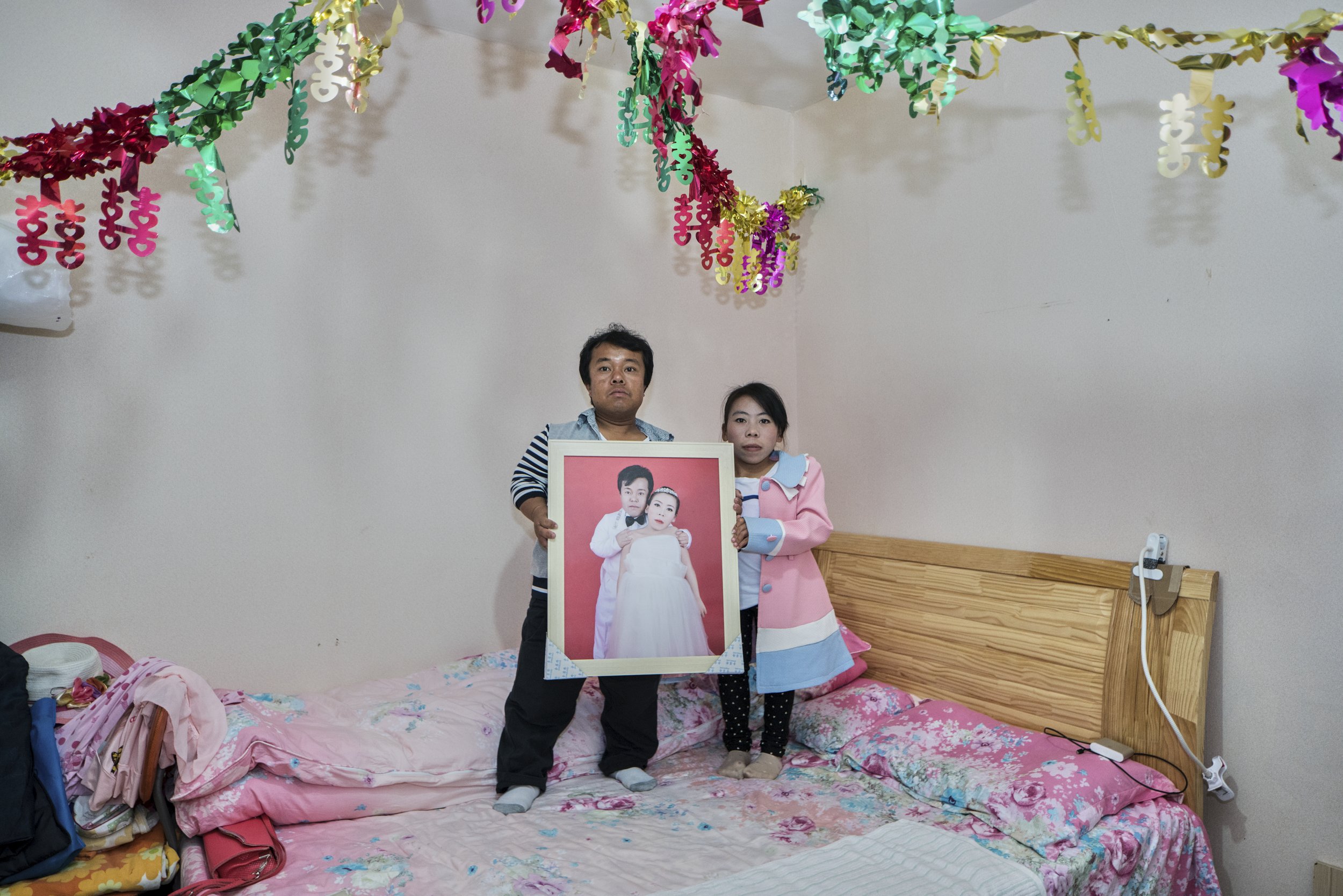 Married couple in Dwarf Empire amusement park. China, 2015