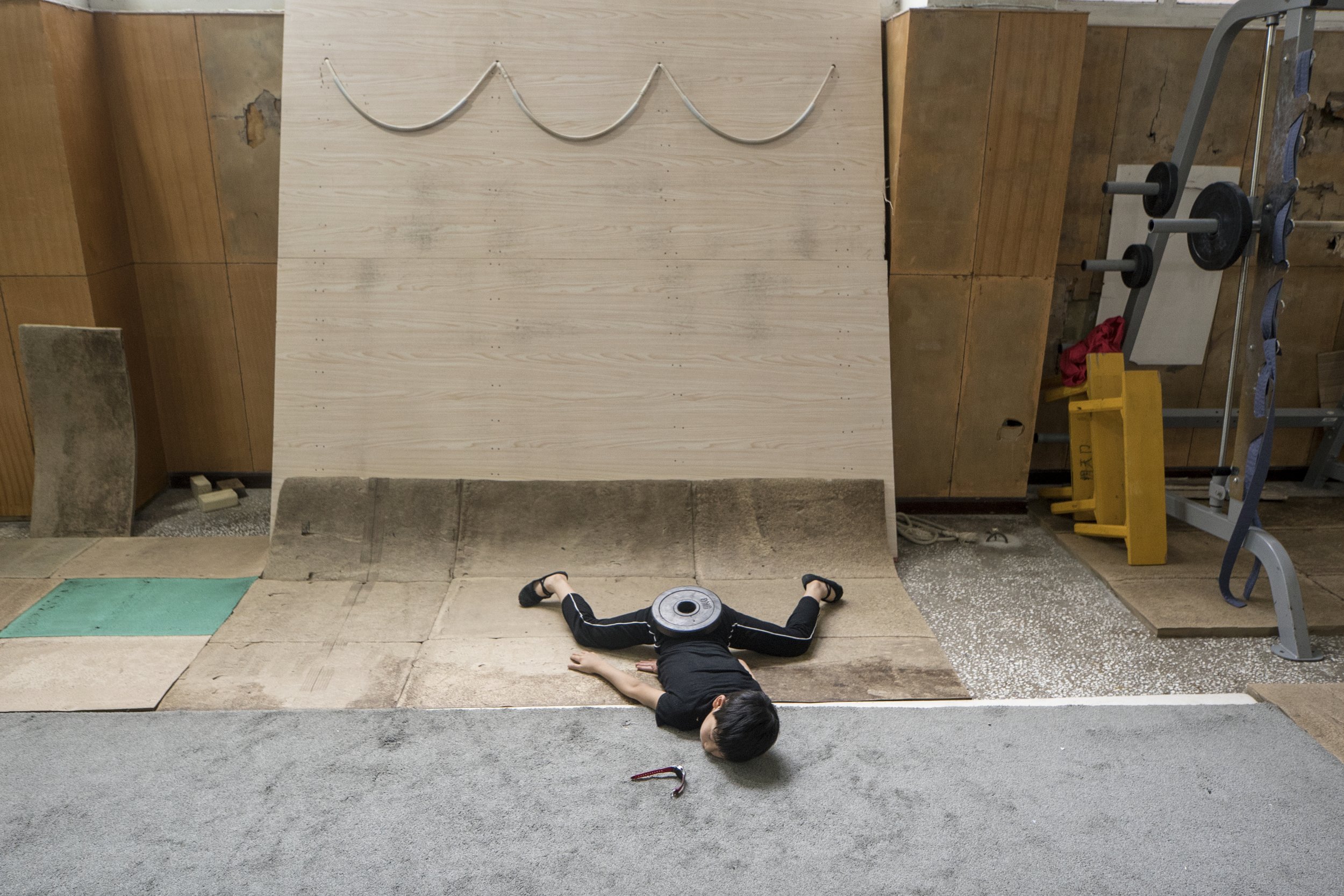 Pupil training at acrobatics school. China, 2015
