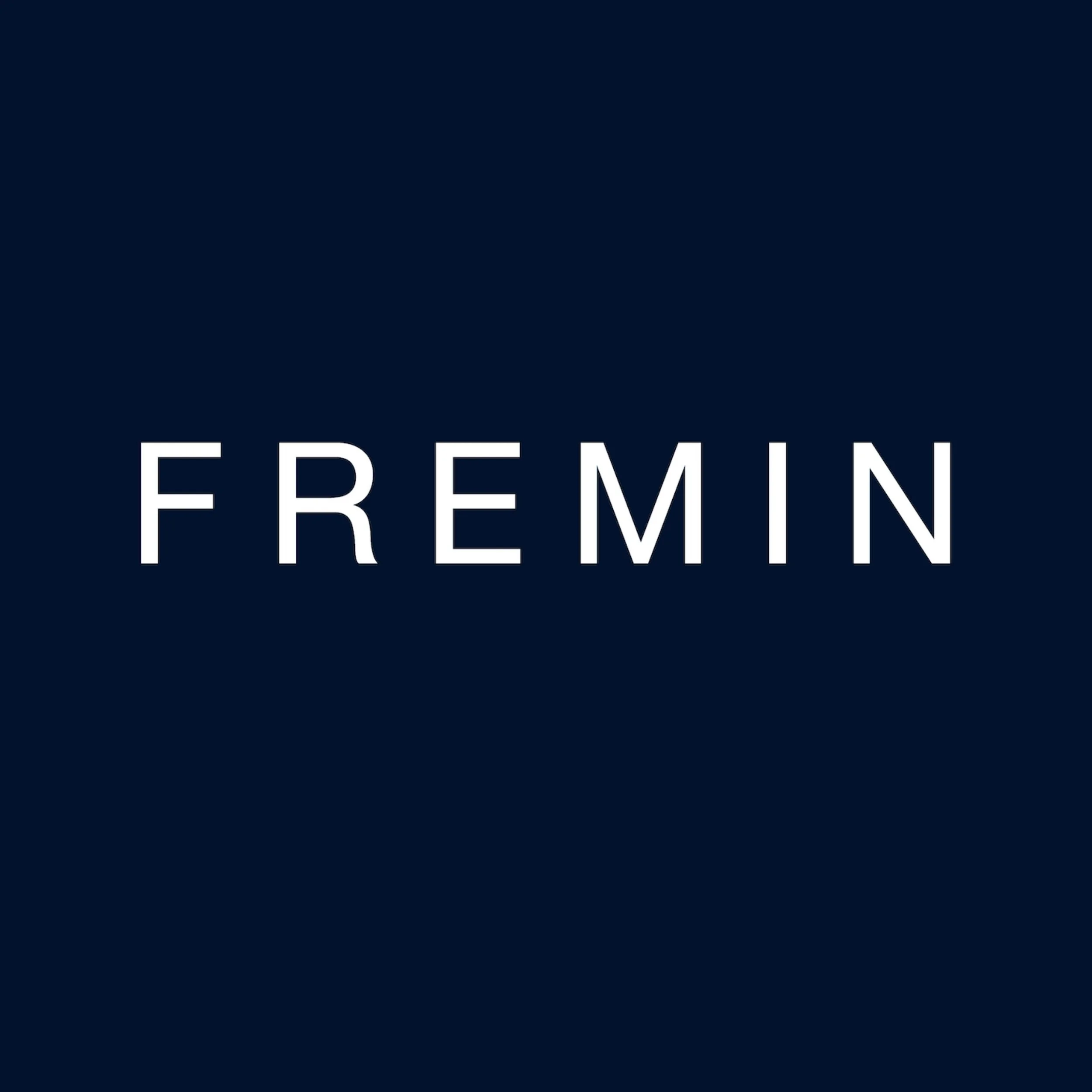 Close-up of a dark blue background with the word 'FREEMIN' in white capital letters, partial text