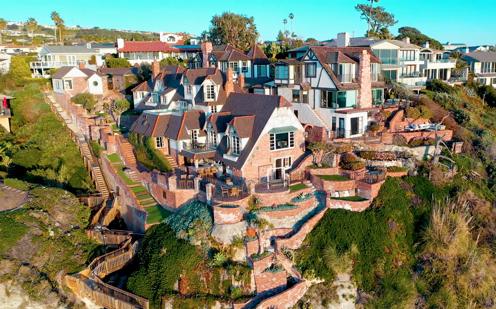 Drone view of the property, grounds, and grand staircase