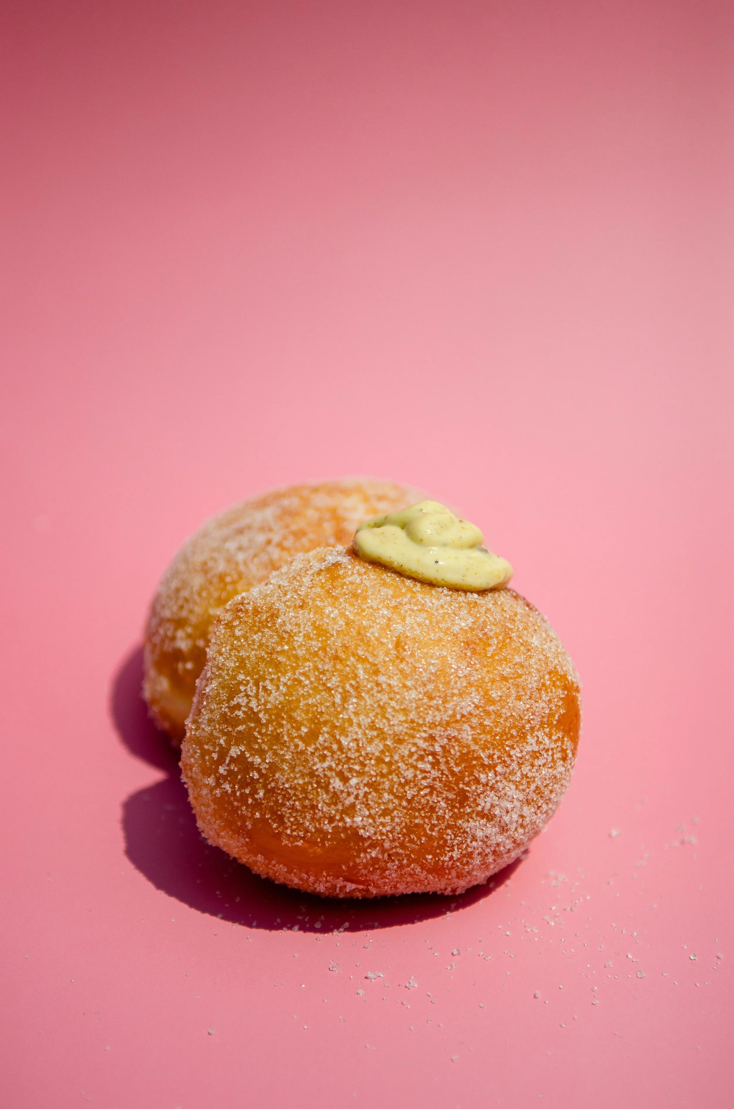 Bomboloni donut with pistachio praline cream