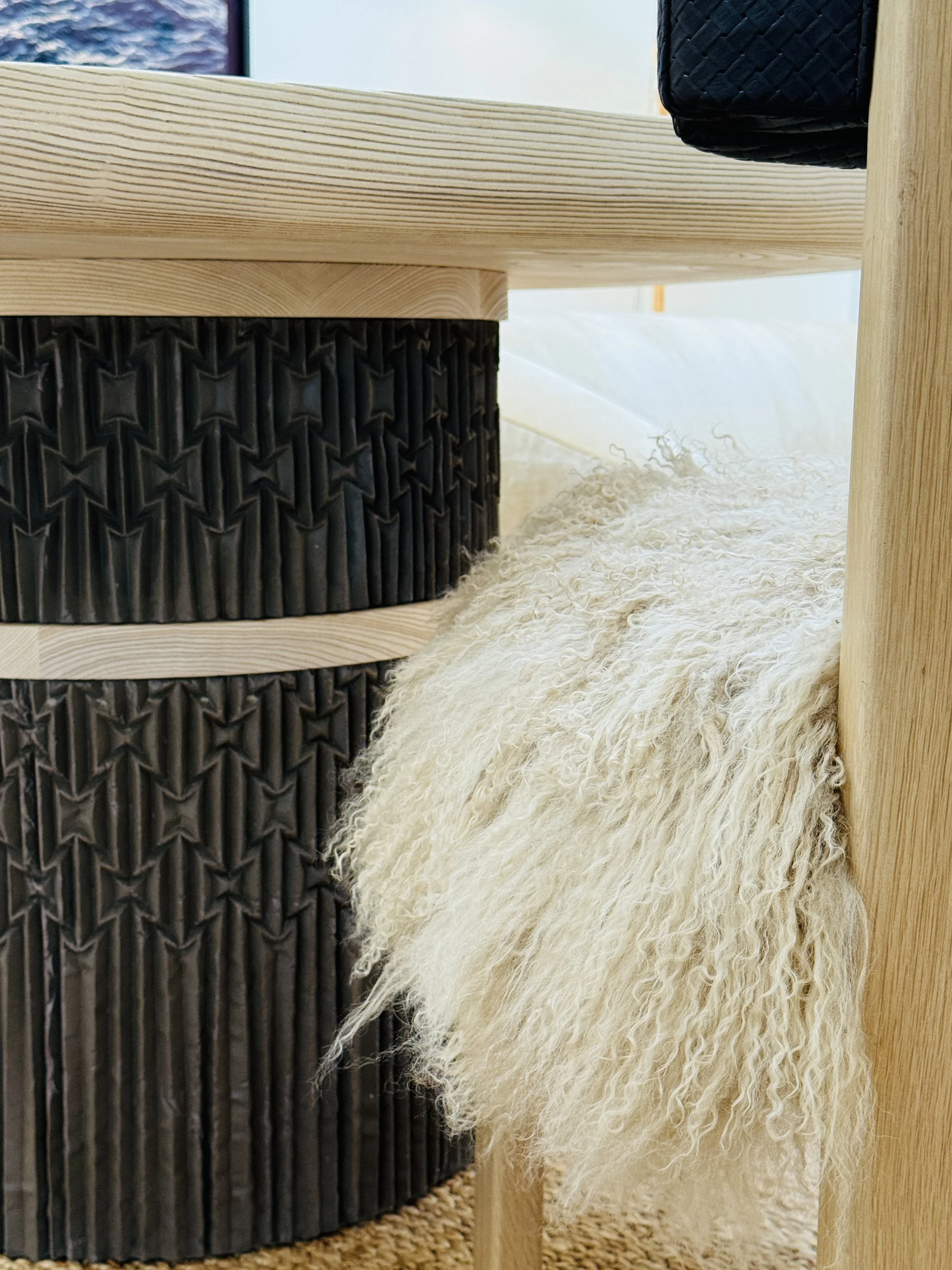 Plinth series of concrete table bases by O.M. Studio. Made from hand-scored pleating fabric paper. Dining table detail of concrete at Stahl + Band, Los Angeles.
