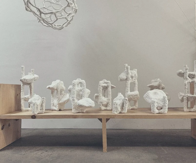 Hand sculpted, brutalist, gypsum candle sticks by artists Krislyn Komarov and James Benn, O.M. Studio, Los Angeles.