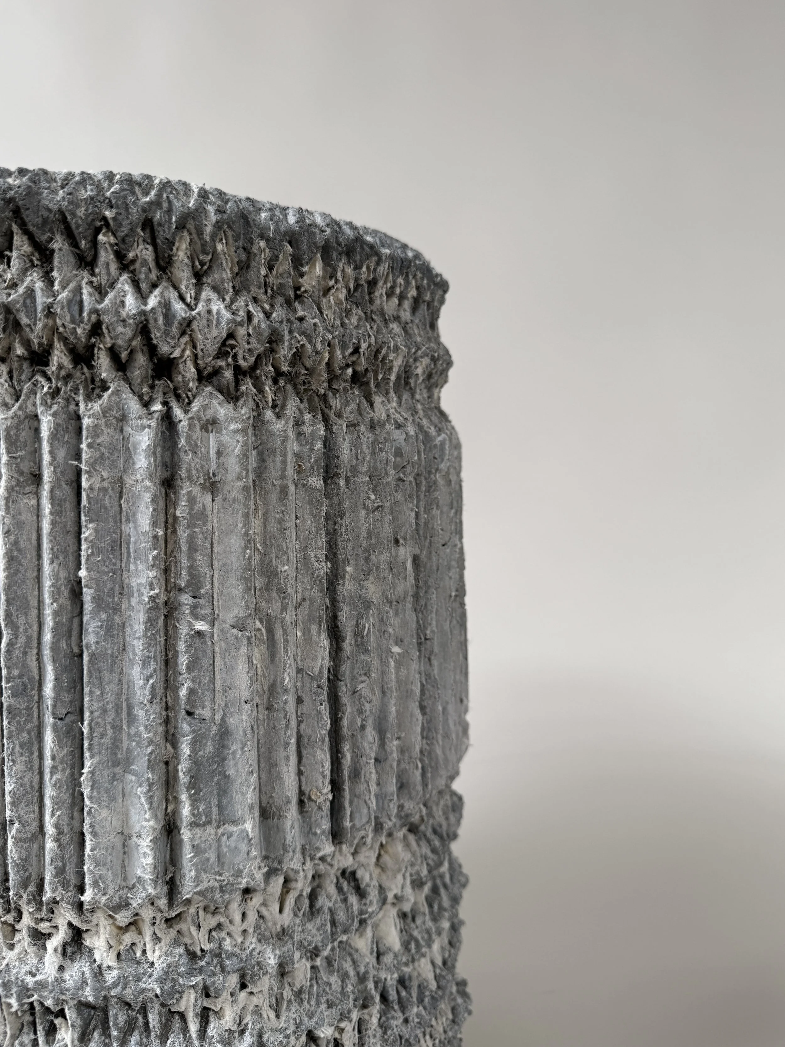 Concrete bases with pleated paper design, Los Angeles. Grey concrete samples.