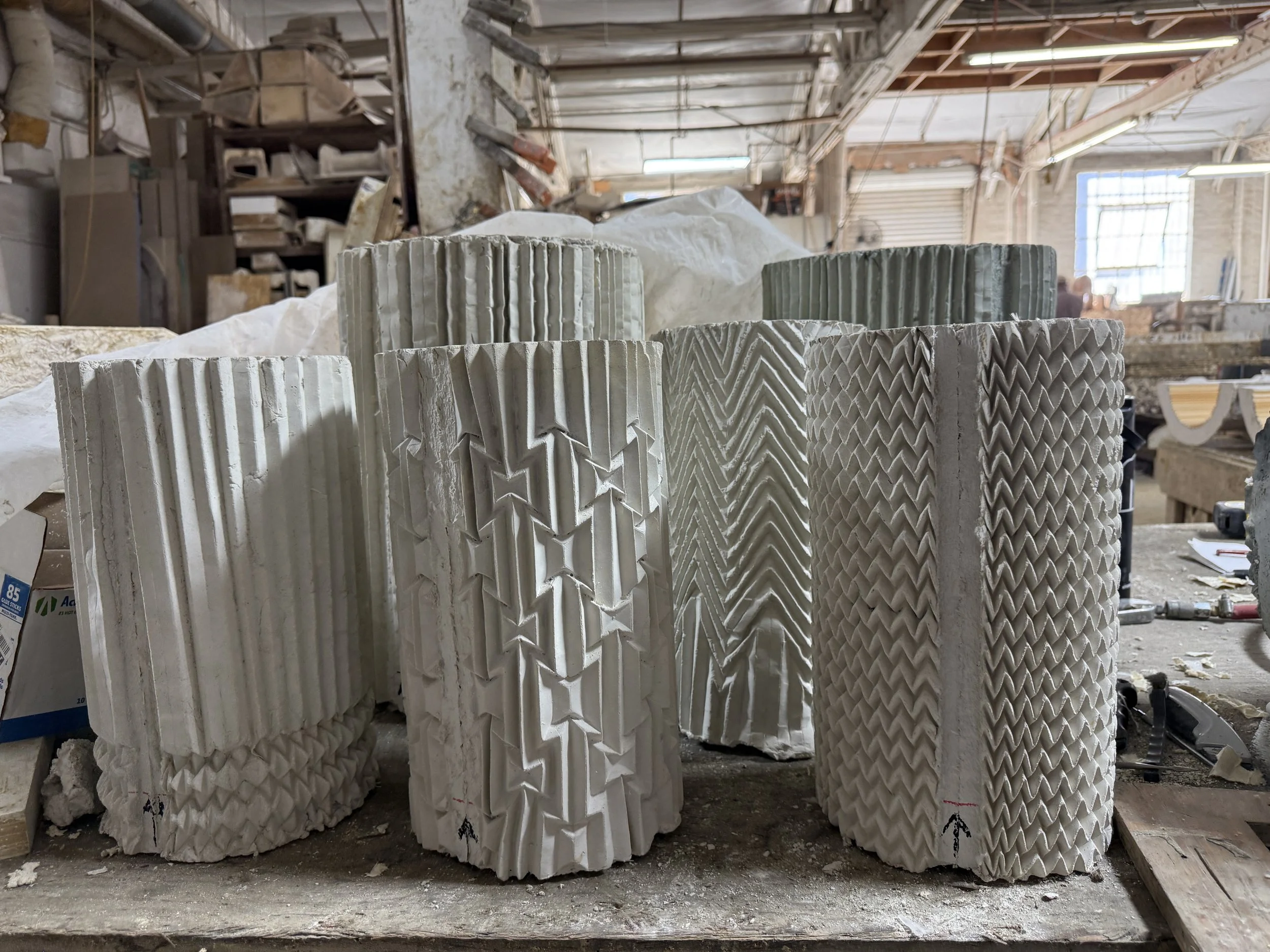 Concrete bases with pleated paper design, Los Angeles. Grey concrete samples.