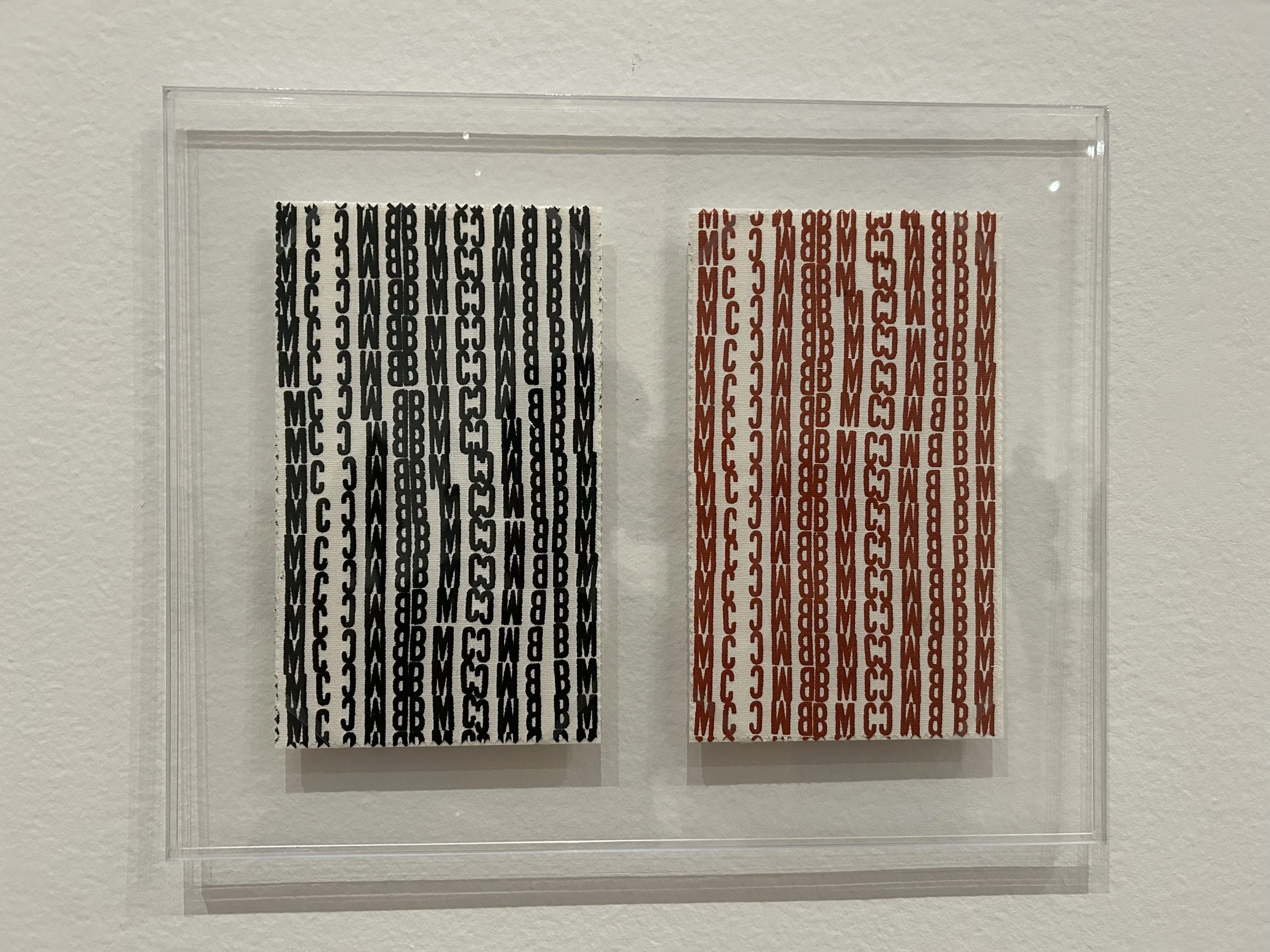  Left:   Untitled (SF.018a, Sample of BMC Stamp Mattress Ticking Design - Black) 1952   Right:   Untitled (SF.018a, Sample of BMC Stamp Mattress Ticking Design - Brown) 1952   Ink on Fabric   Private collections 