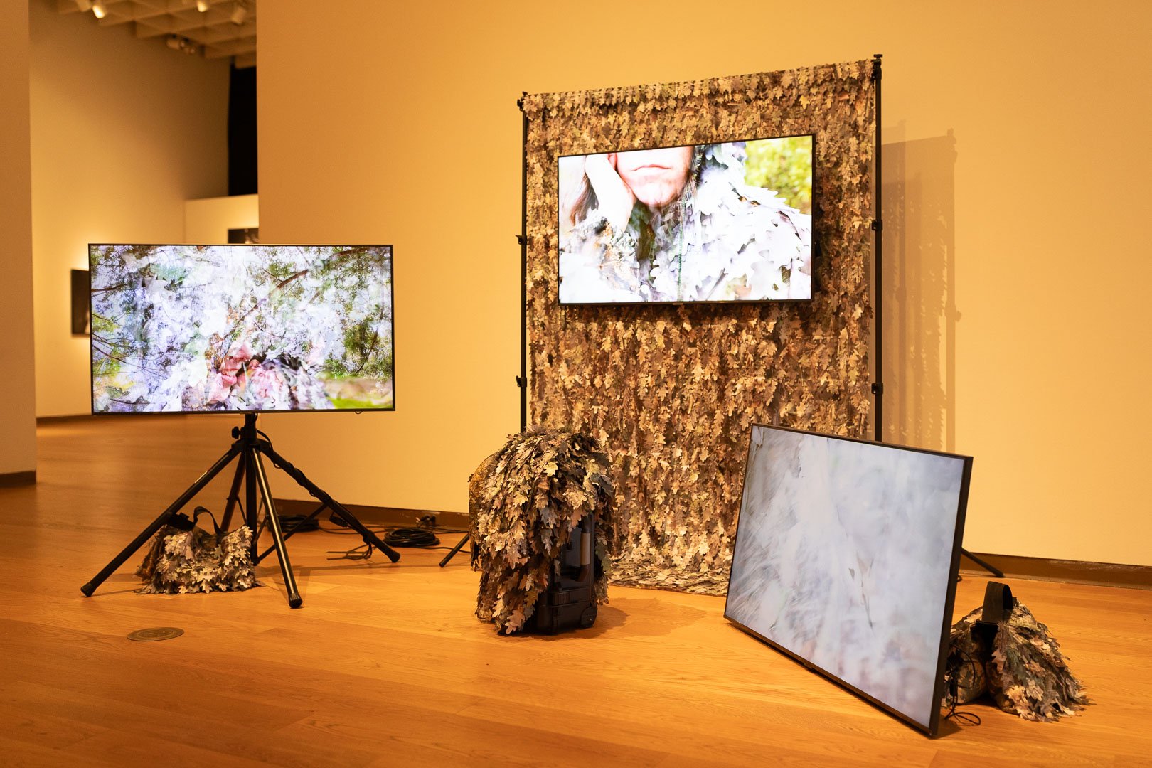  Meredith Laura Lynn and Katie Hargrave  (b. Boston, MA, 1984)  (b. Chicago, IL, 1985)  Bad Outdoorsmen (Application Video) (Northeast Florida) (Vignette 1)  2024  5 channel video with sculptural elements including lasercut polysilk textiles and  pho