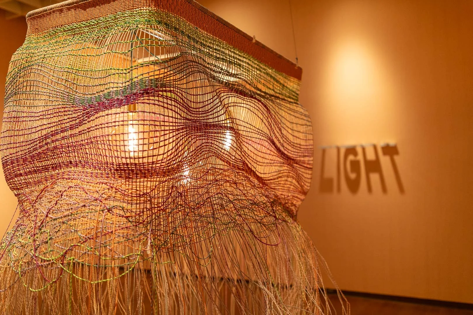  Jessy Nite  (b. Montclair, NJ, 1985)  LANDS END  2026  Hanging textile light work  90 x 68 x 48 in.  Courtesy of the Artist  Photography by Laura Serdiuk, Women in the Arts, Inc. 