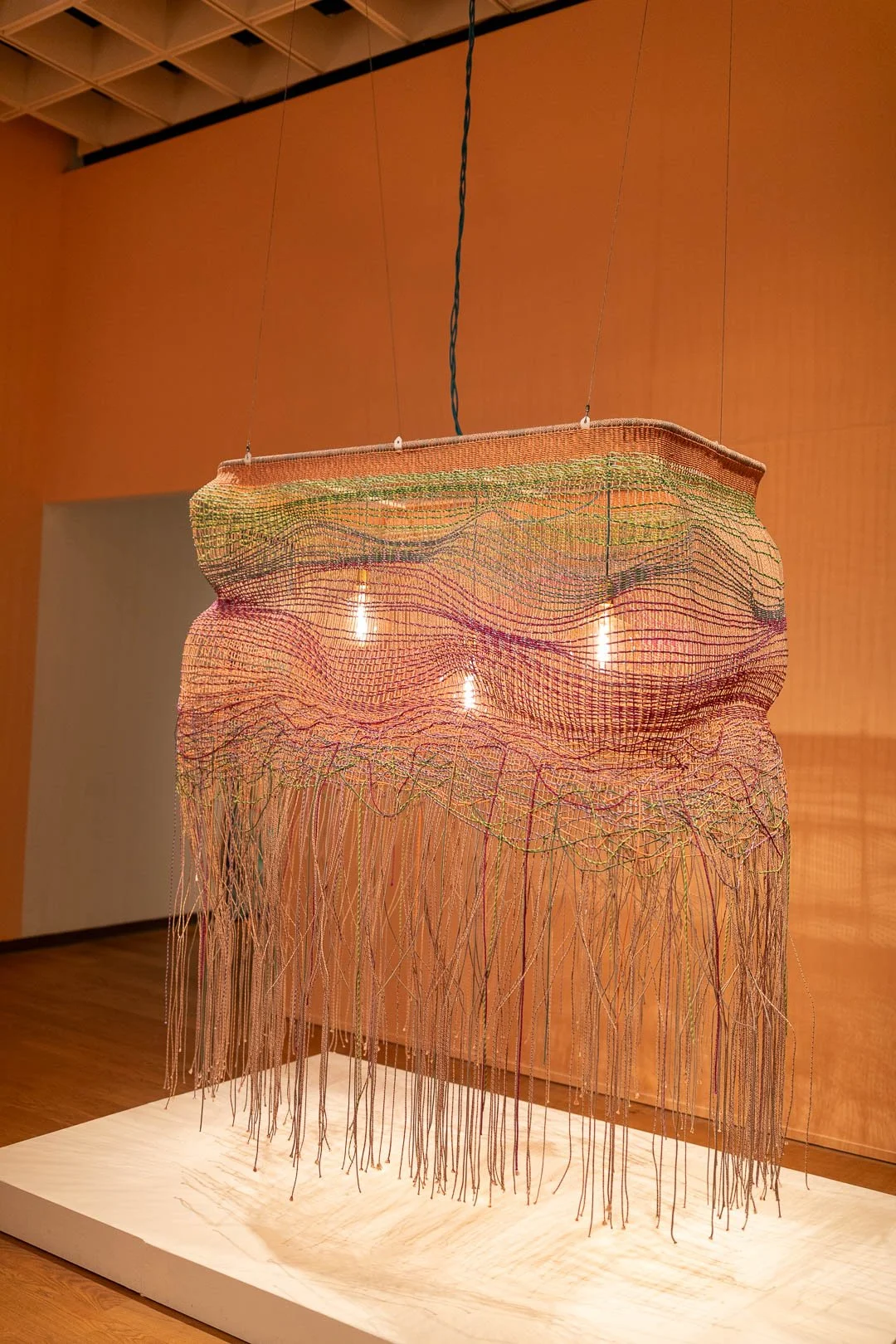  Jessy Nite  (b. Montclair, NJ, 1985)  LANDS END  2026  Hanging textile light work  90 x 68 x 48 in.  Courtesy of the Artist  Photography by Laura Serdiuk, Women in the Arts, Inc. 