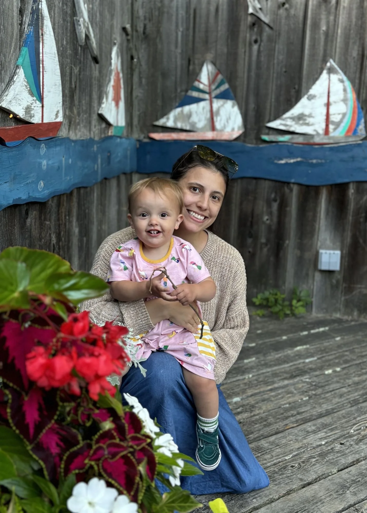 Alie Moya, Brooklyn Manny and Nanny founder, posing with  her daughter.
