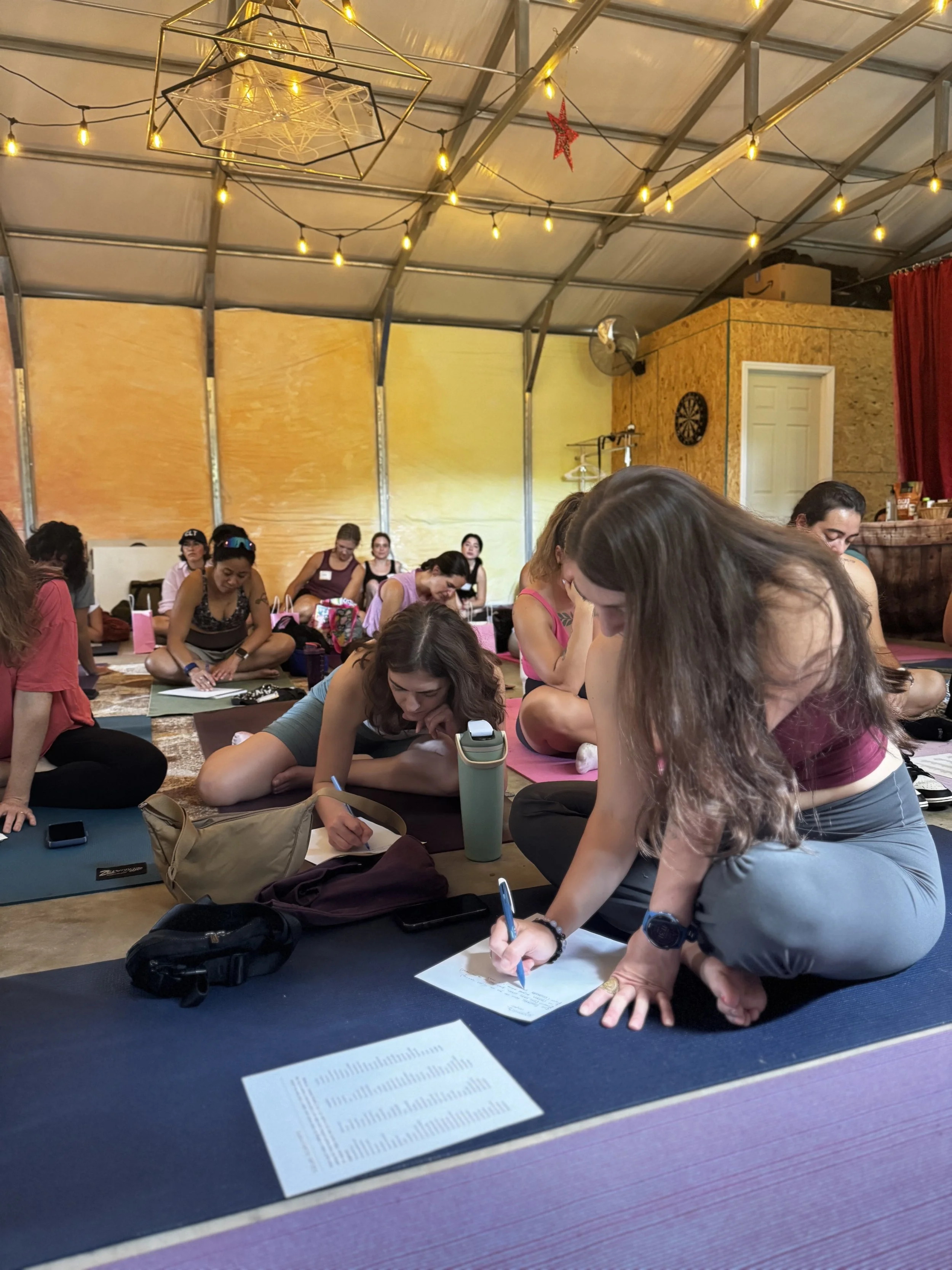 Holistic wellness practitioners gathered in Charlotte, NC community space representing Wellness Wonderland directory, events, and collaboration hub