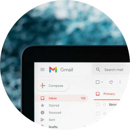 Computer screen displaying Gmail inbox with 152 unread emails, showing the compose button and search bar at the top.