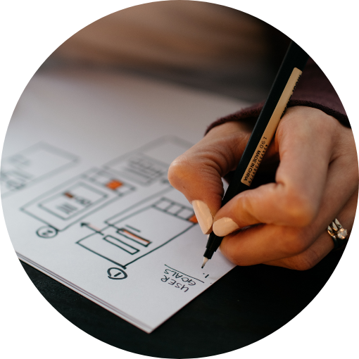 A person creating a low fidelity wireframe for website redesign.
