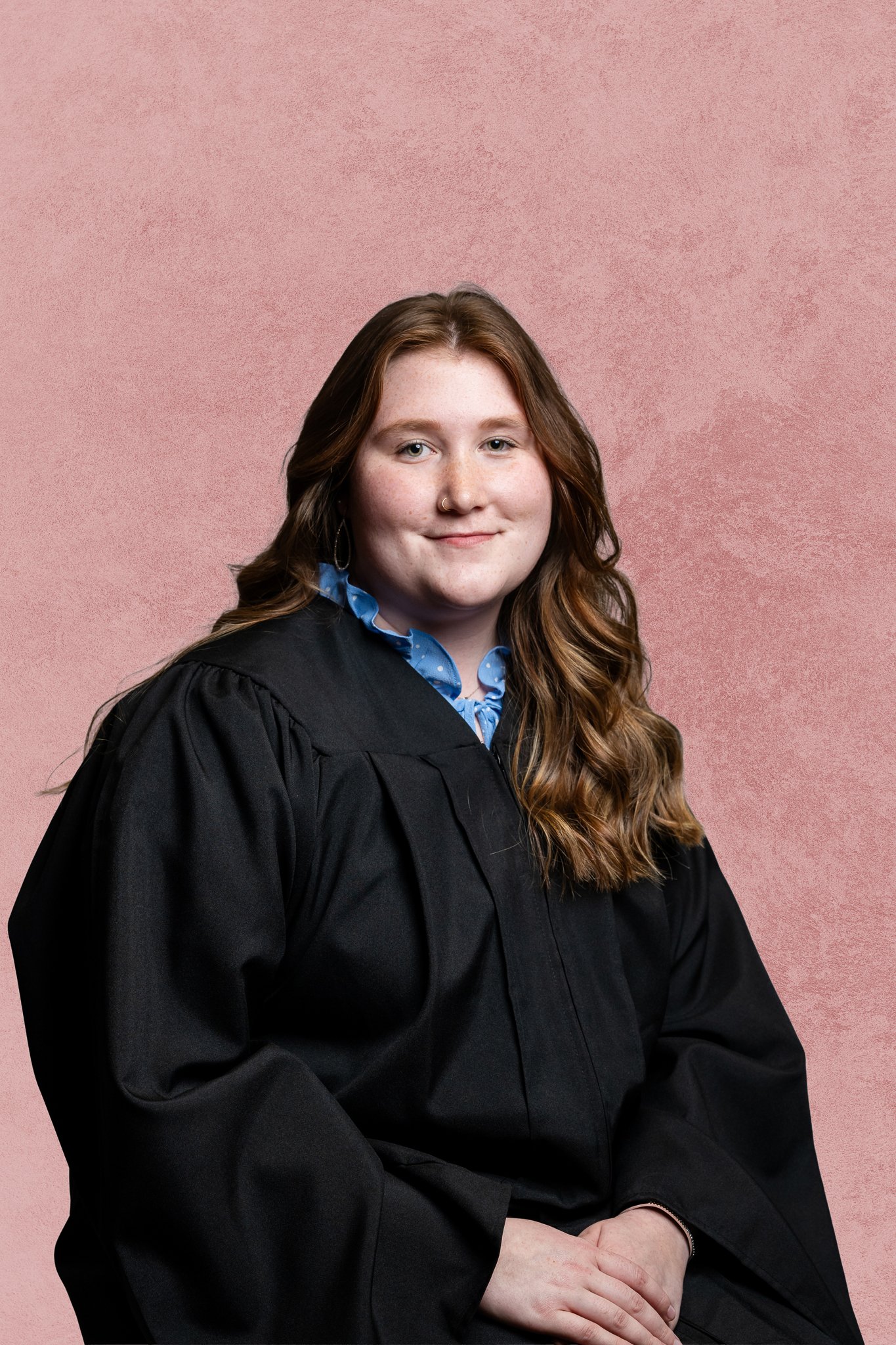 studio grad portrait with pink backdrop