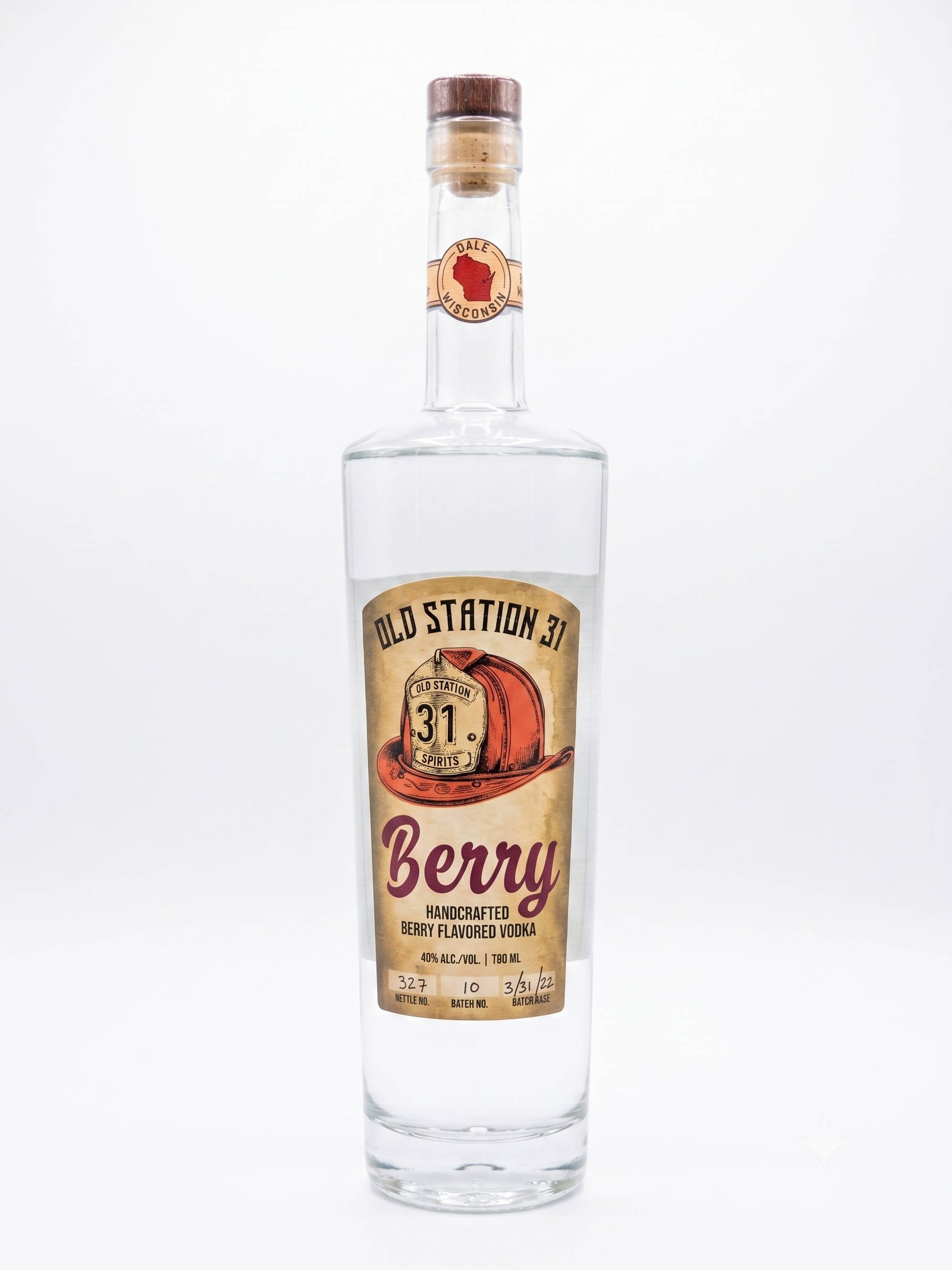 A tall clear glass bottle of berry-flavored vodka with a wooden cap and a vintage-style label that says 'Old Station 31' and features a red radio. The label also indicates it is handcrafted with 40% alcohol and 790 ml volume.