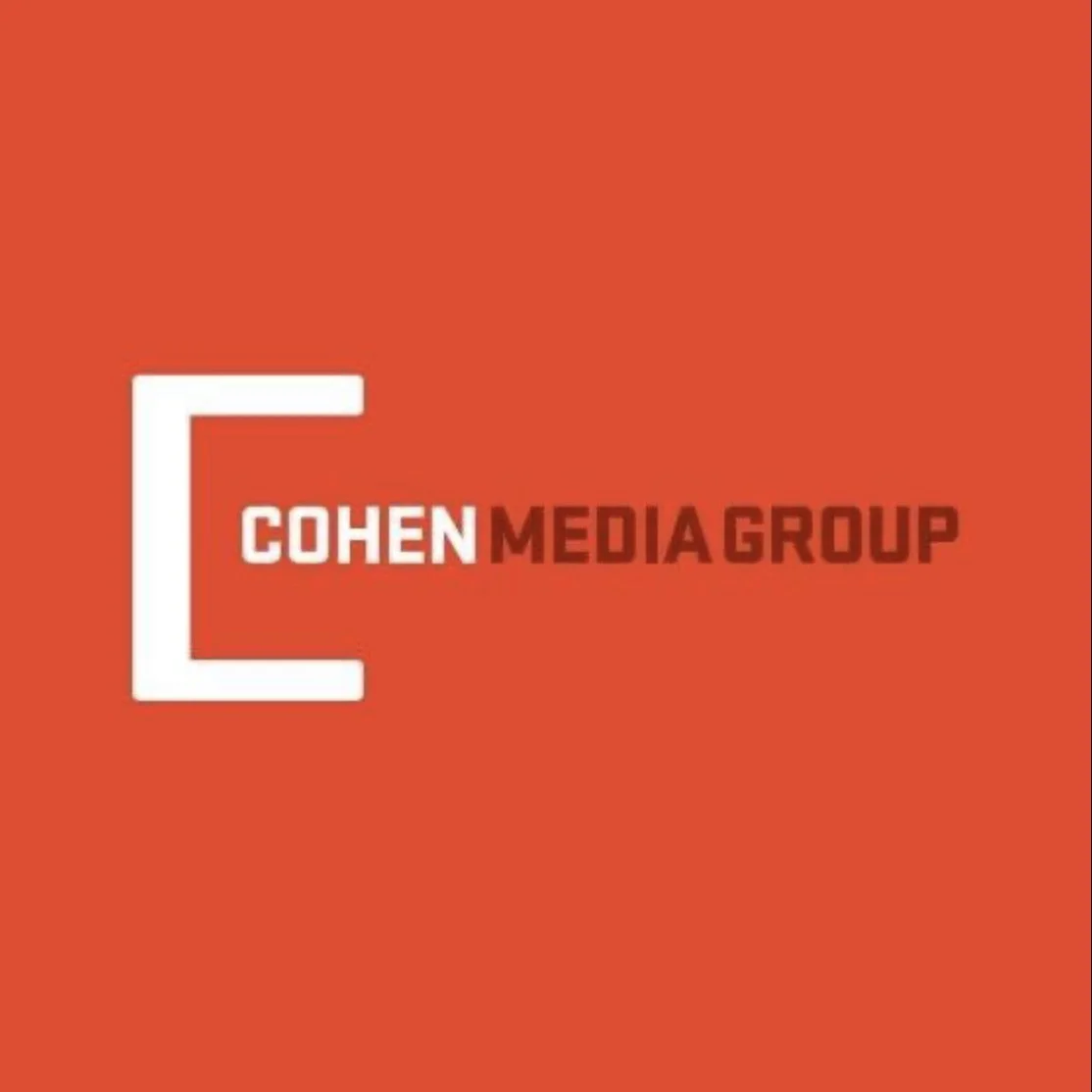 Cohen Media Group logo with a white 'C' shape on a red background, and the words 'COHEN MEDIA GROUP' in white and dark red text.
