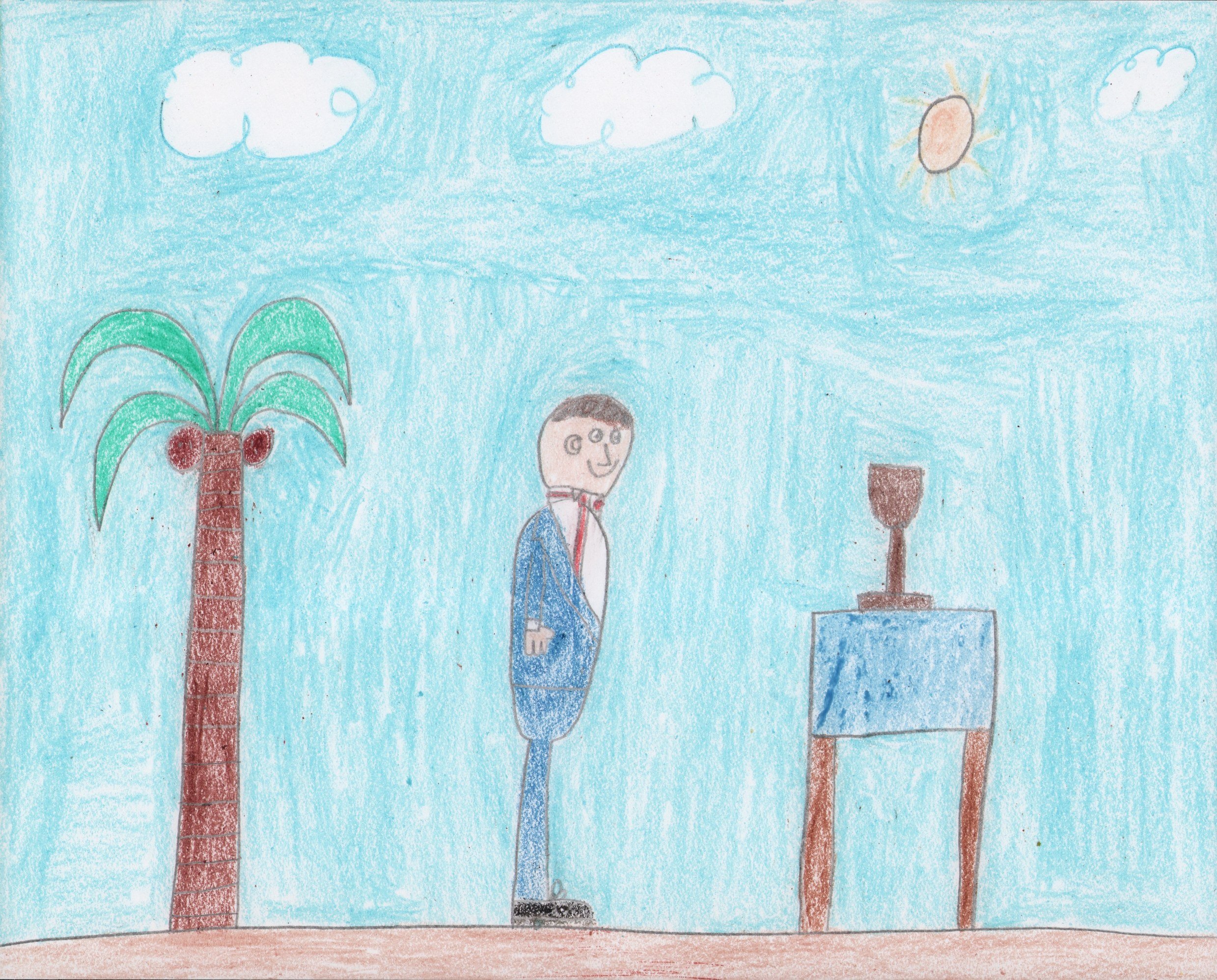 ID: A person in a blue suit stands in a desert setting between a palm tree and a table with a chalice on it.