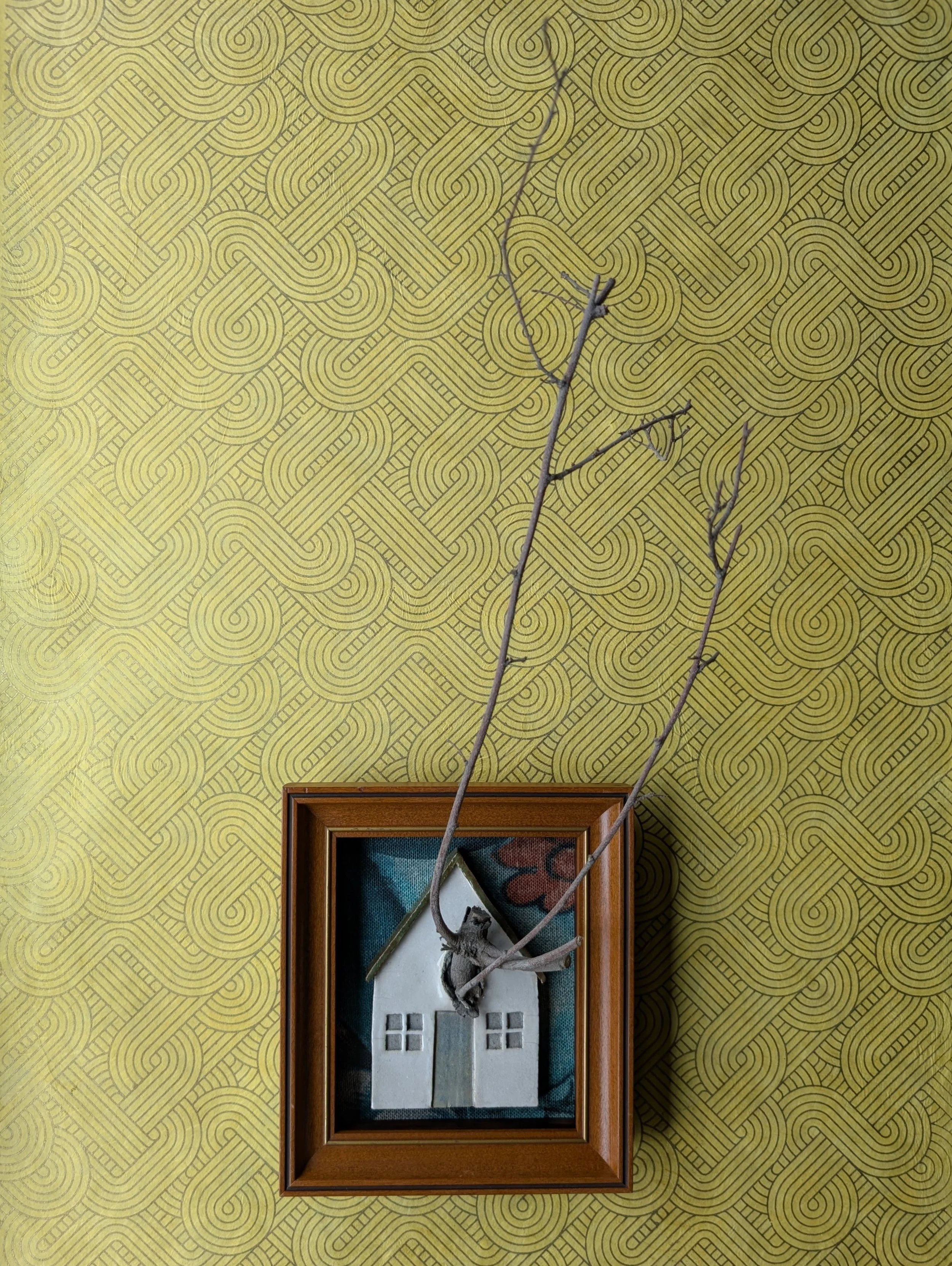 cottage pierced by barren tree (19" x 8" x 9")