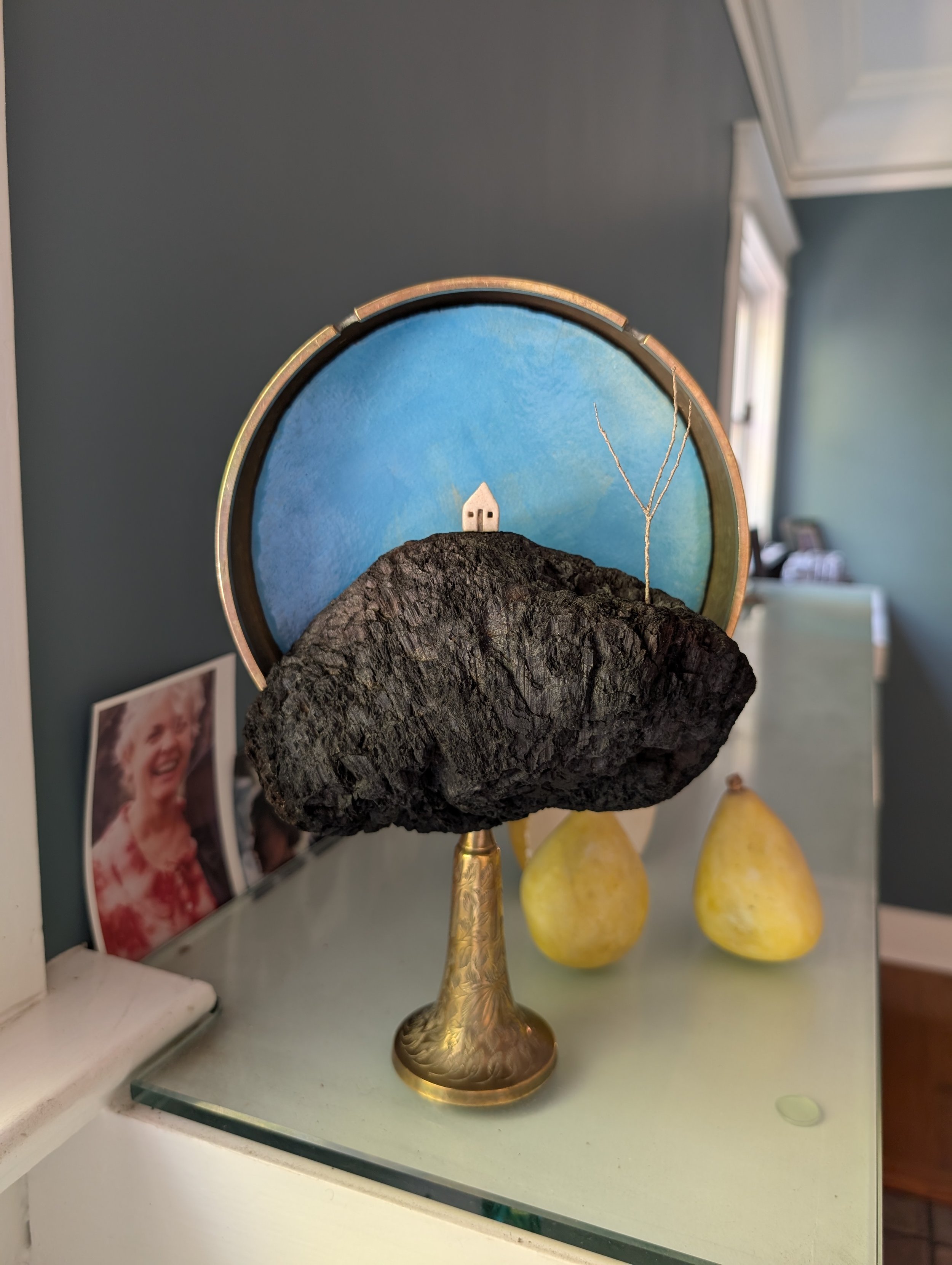 charcoal cliff barely framed in brass (11" x 7" x 4")