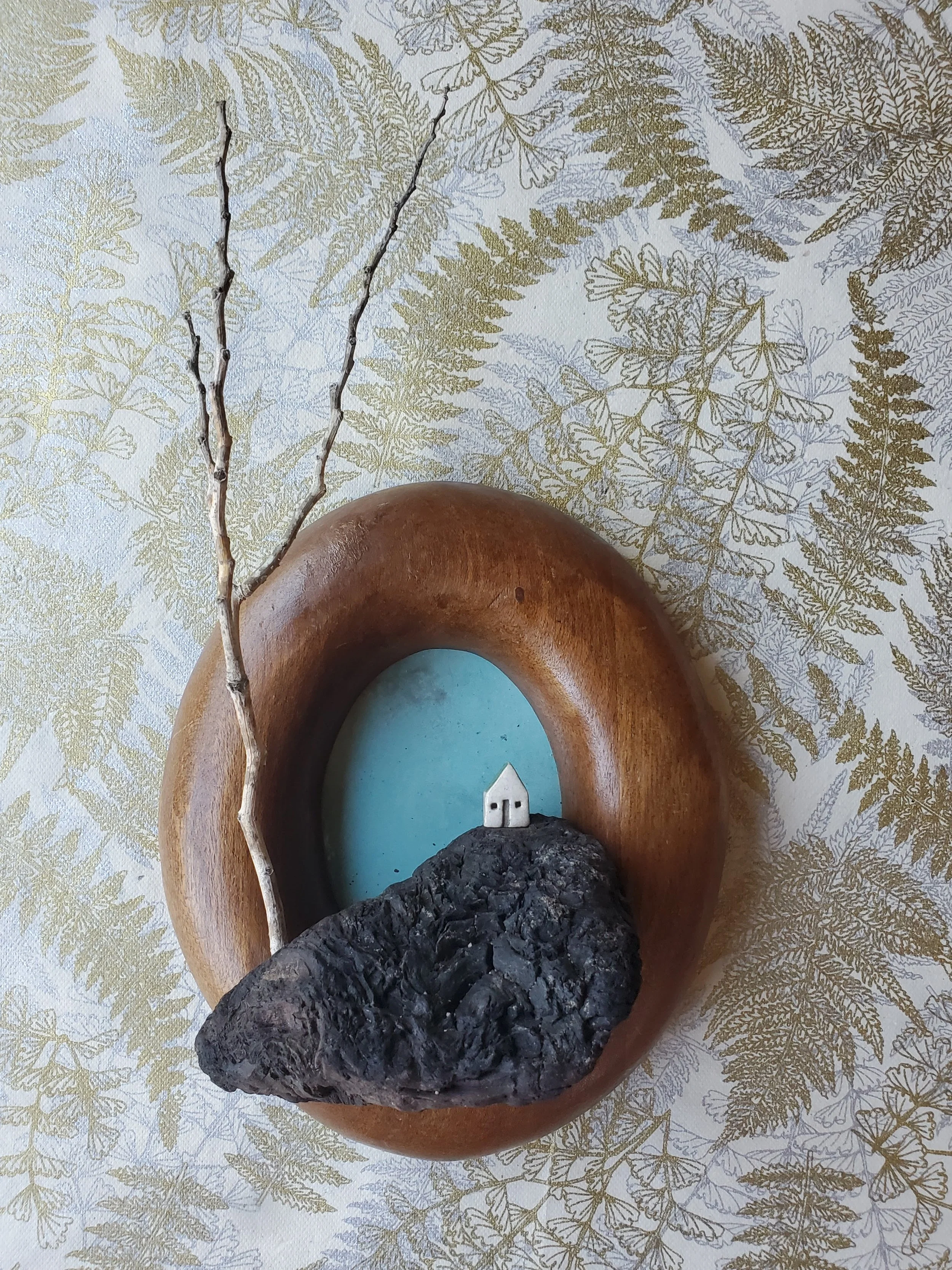 charcoal promontory in oval frame (12" x 6" x 4")