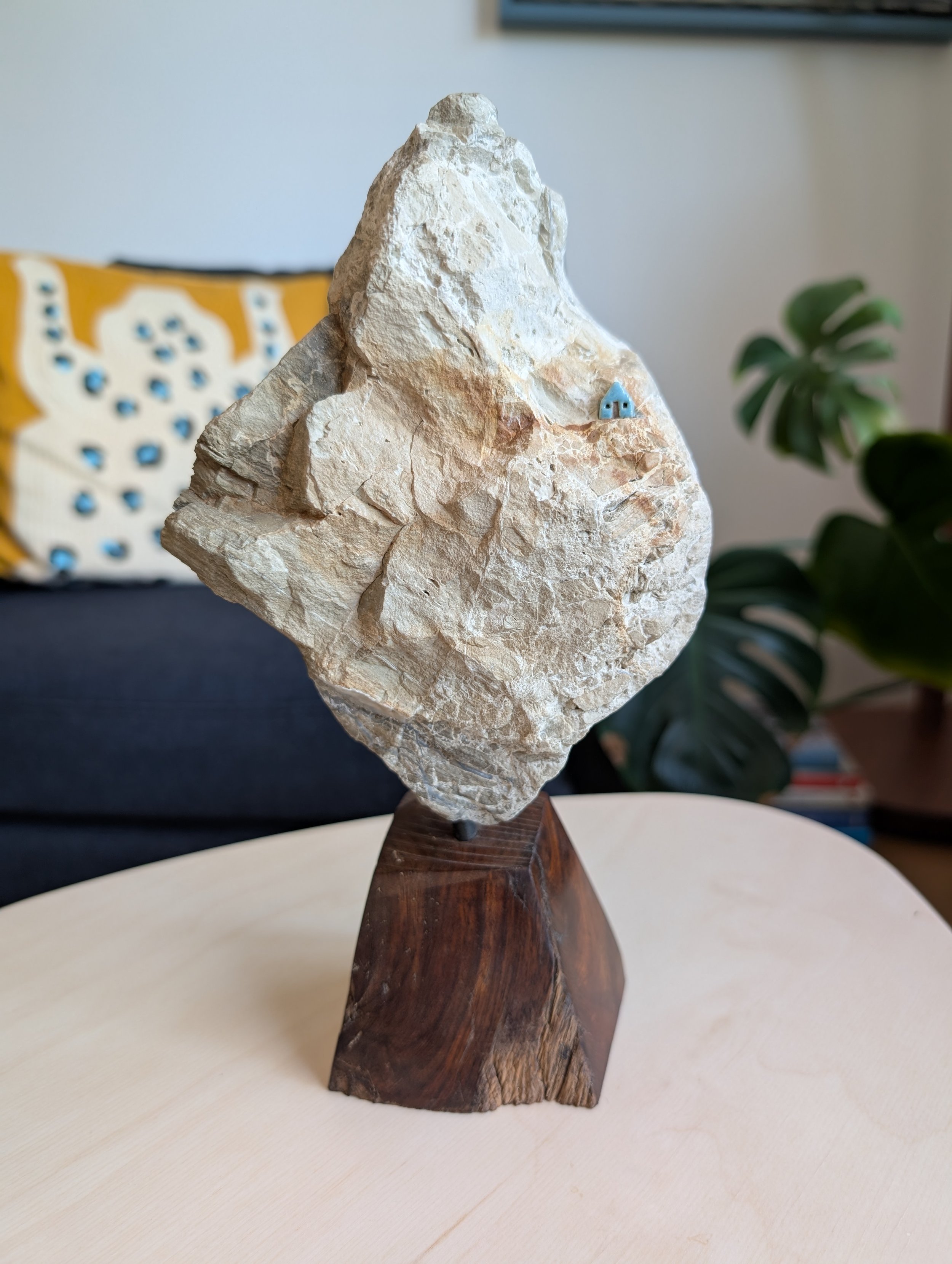 creamy cliff on polished wood base (9" x 5" x 3")