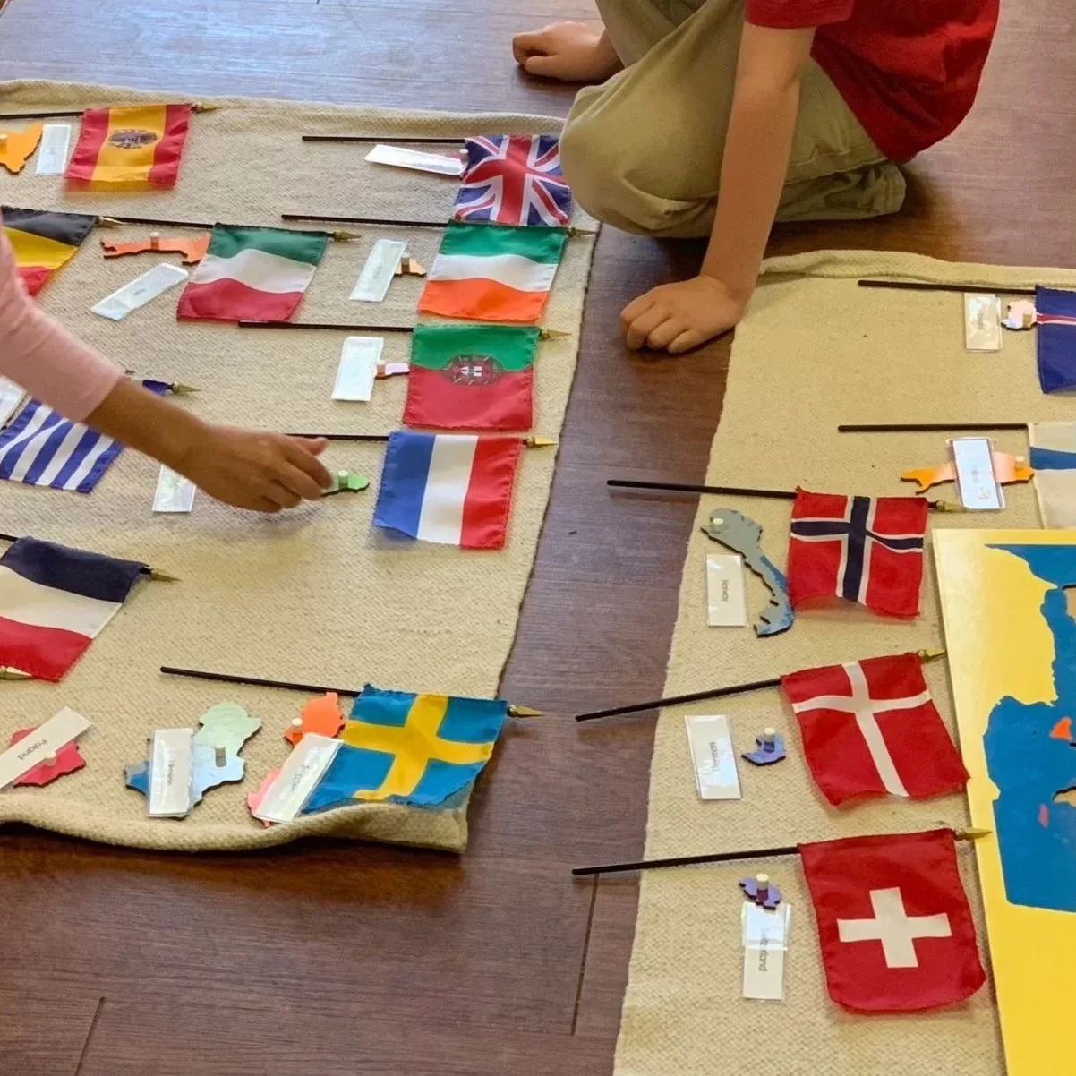 Friends Work Together On the Map of Europe 