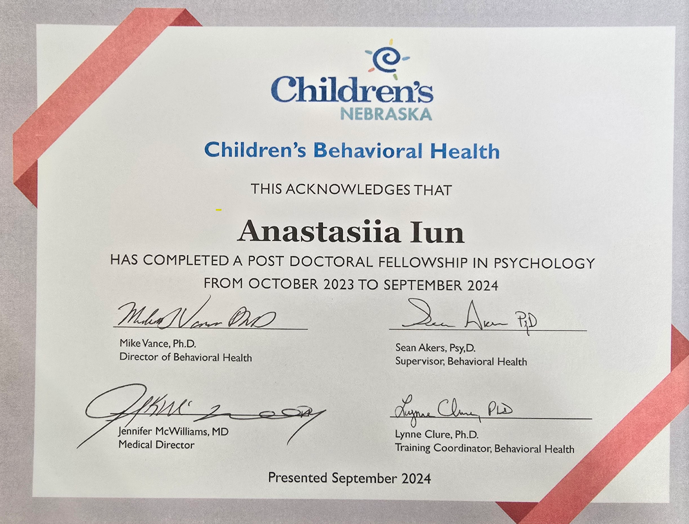 Certificate from Children's Nebraska recognizing Anastasia Iun for completing a postdoctoral fellowship in psychology from October 2023 to September 2024, signed by several professionals including Mike Vance and Jennifer McWilliams.