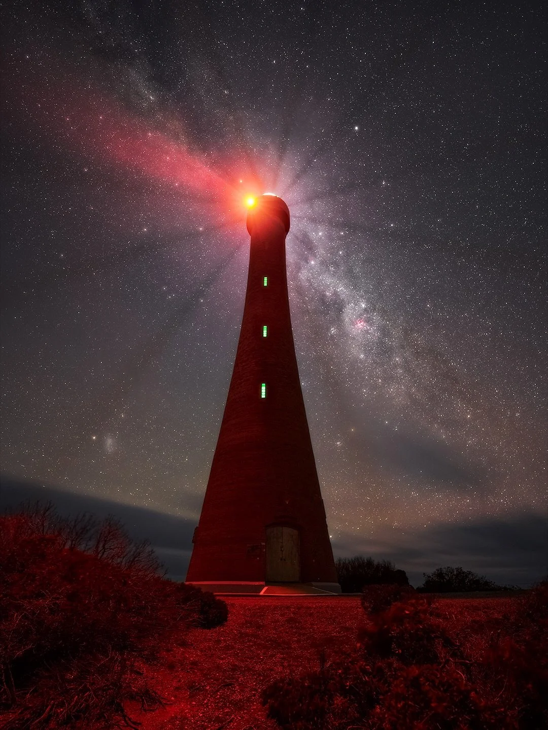 Troubridge Point Lighthouse under the stars. 

Yep this one is not only made of red brick, it also has an intense red light. I love lighthouses so had to give it a crack. It took some tweaking with selective color masks to tone down some random spots