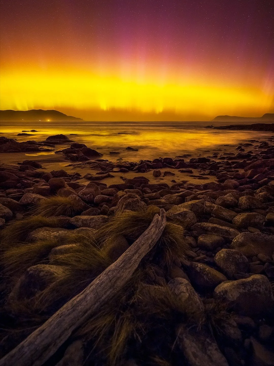The aurora shines bright over the rocky and beautiful Cloudy Bay, on Bruny Island, Tasmania. 

That&rsquo;s a wrap! Tasmania did not disappoint and this aurora happened on the very last night (21 March, 2026) of my Bruny Island workshop. Taken at Clo
