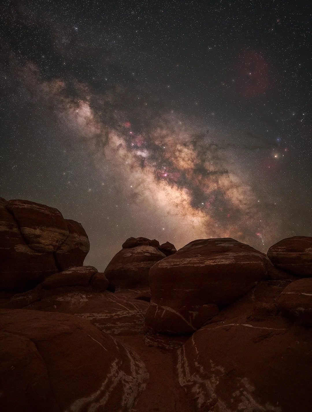 The Milky Way rises above the ancient red-and-white hoodoos within the Hopi Reservation in northeastern Arizona.

At first glance, the white markings look like they were painted by hand. In reality, they were created naturally over millions of years 