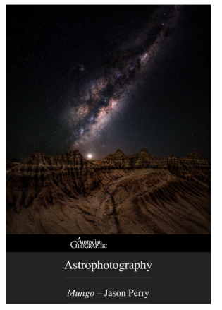 Night sky with the Milky Way galaxy over rugged, rocky landscape.