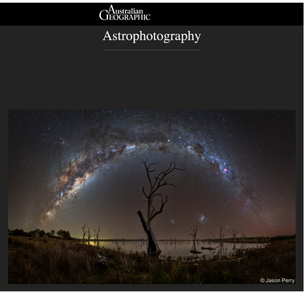 Cover of Australian Geographic magazine featuring a night sky with the Milky Way galaxy and a barren tree silhouette over a body of water.