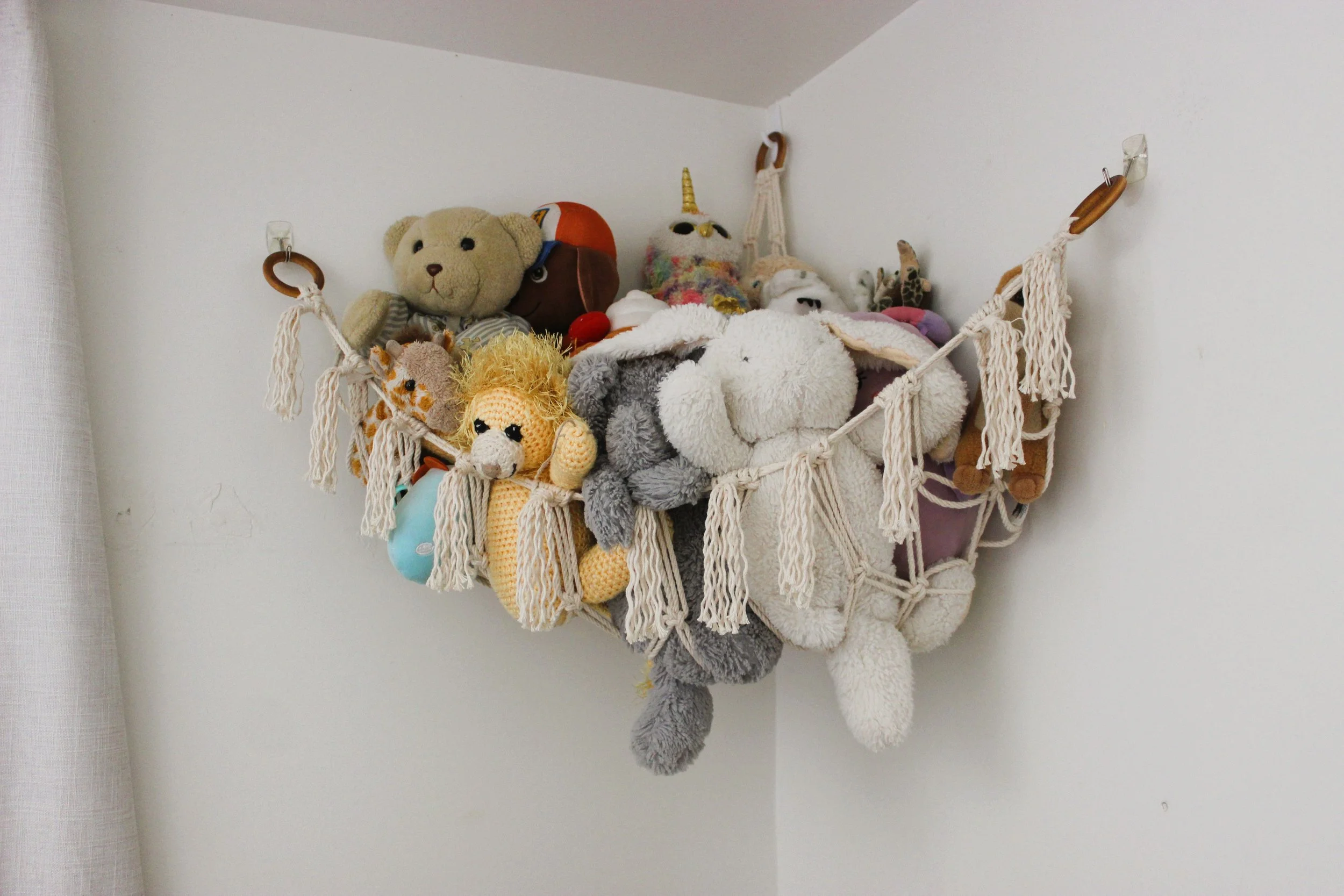 Macrame Corner You hammock used to store stuffed toys for kids