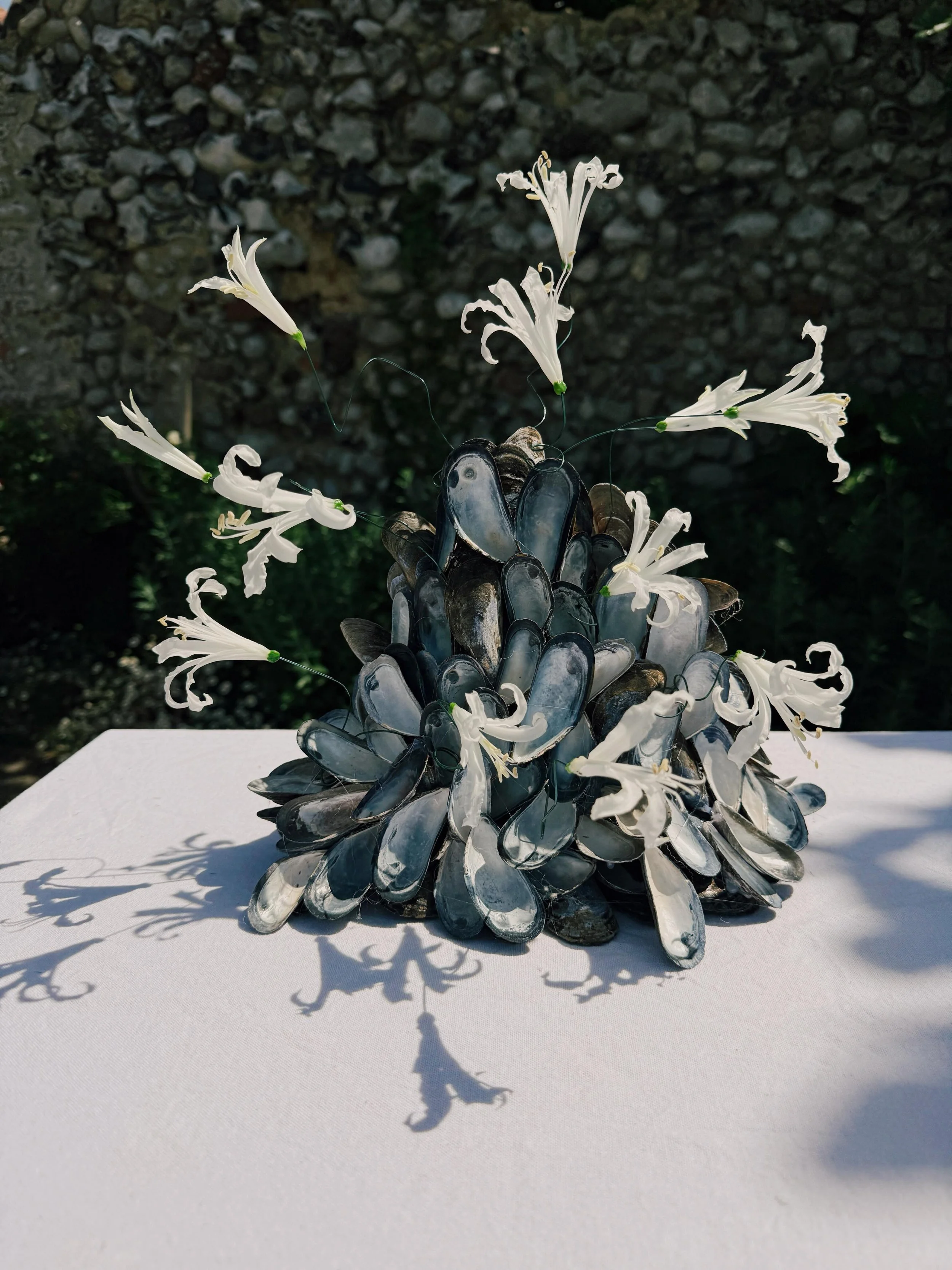 I&rsquo;m still completely captivated by Lily and Sam&rsquo;s Gohar World&ndash;inspired mussel towers.

Designed and created by bride Lily using locally sourced Norfolk mussels, these sculptural pieces felt like the perfect expression of the landsca